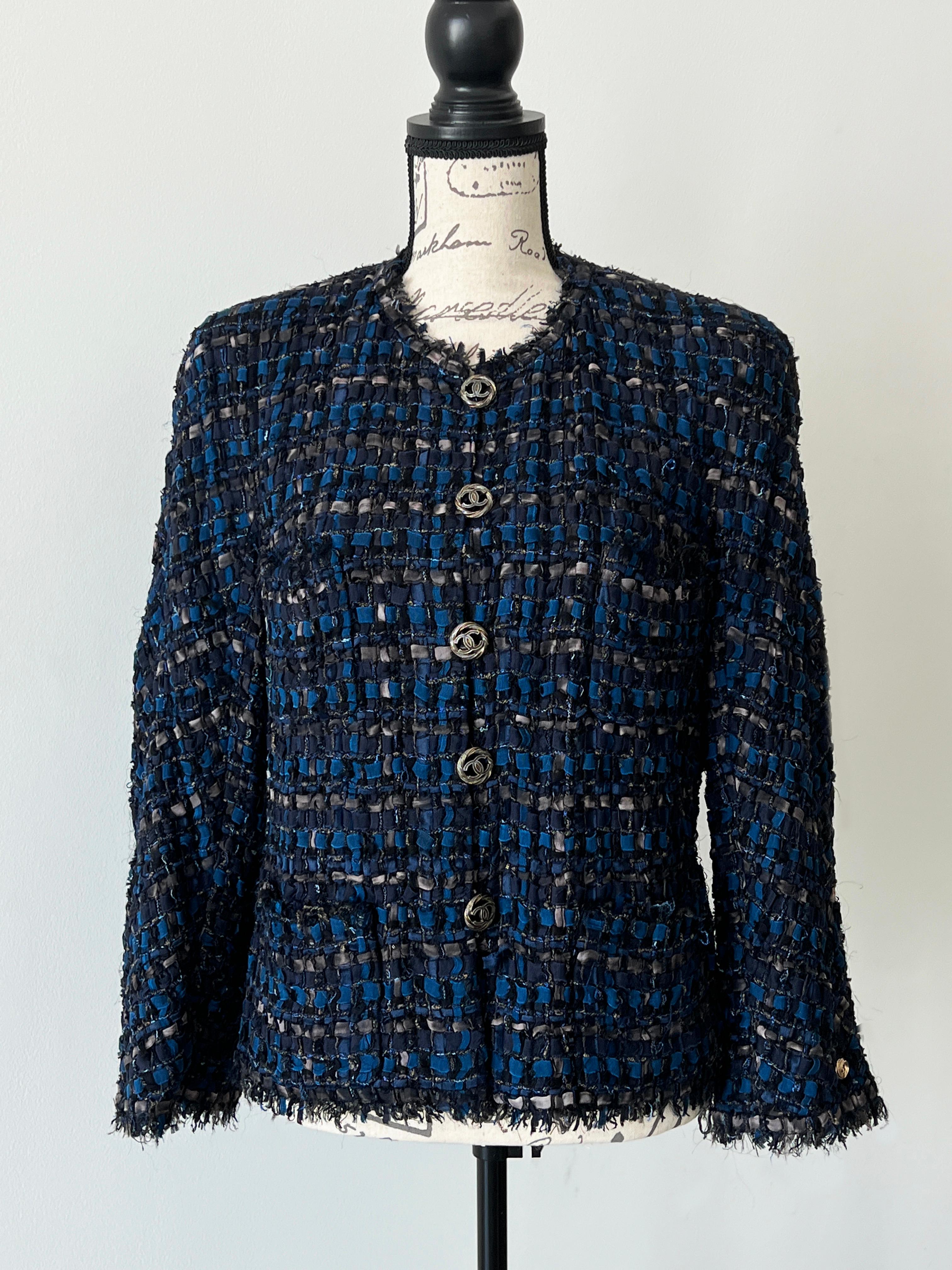Iconic Chanel black / blue tweed jacket made of most precious ribbon tweed
- the price of similar now in boutique is over 15,000€
- CC logo buttons at front
- CC logo charm at sleeve
- full silk lining, chain link at interior hem
Size mark 46 FR.