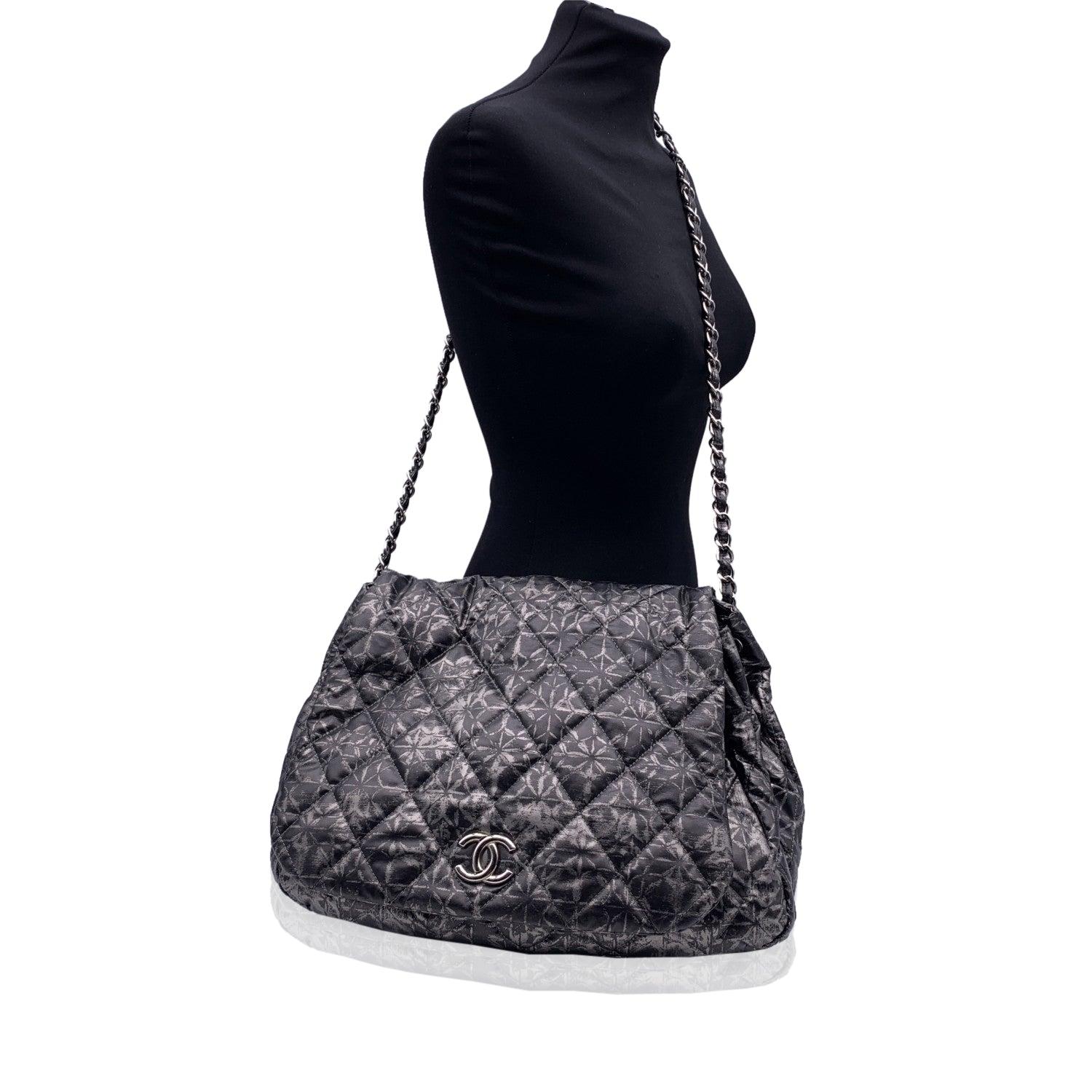 Chanel 'Rock in Moscow' Accordion Flap Bag crafted from metallic grey padded nylon in an abstract printed quilted pattern. Flap front with silver metal CC - CHANEL logo with internal magnetic button closure. Silver metal chain with interwoven nylon.