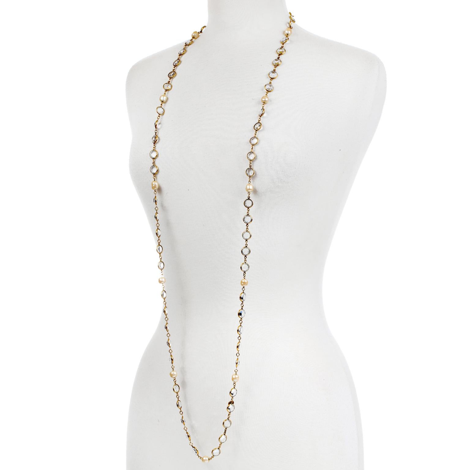 This authentic Chanel Rose Cut Crystal and Pearl Long Necklace is in excellent vintage condition from the 1981 collection.  Gold tone set rose cut crystal beads are linked together on a long necklace.  Interspersed with faux pearls. May be worn