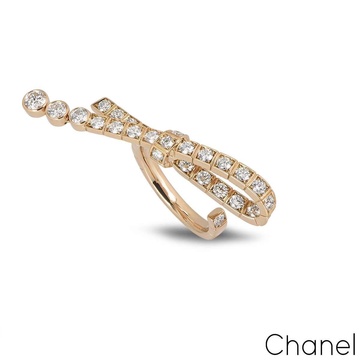 A beautiful ring from the Ruban collection by Chanel. The ring features an articulated bow motif, set with 33 round brilliant cut diamonds with a total weight of 1.36ct, F-G colour and VVS1 clarity. The ring is open at one end and is a size UK K -