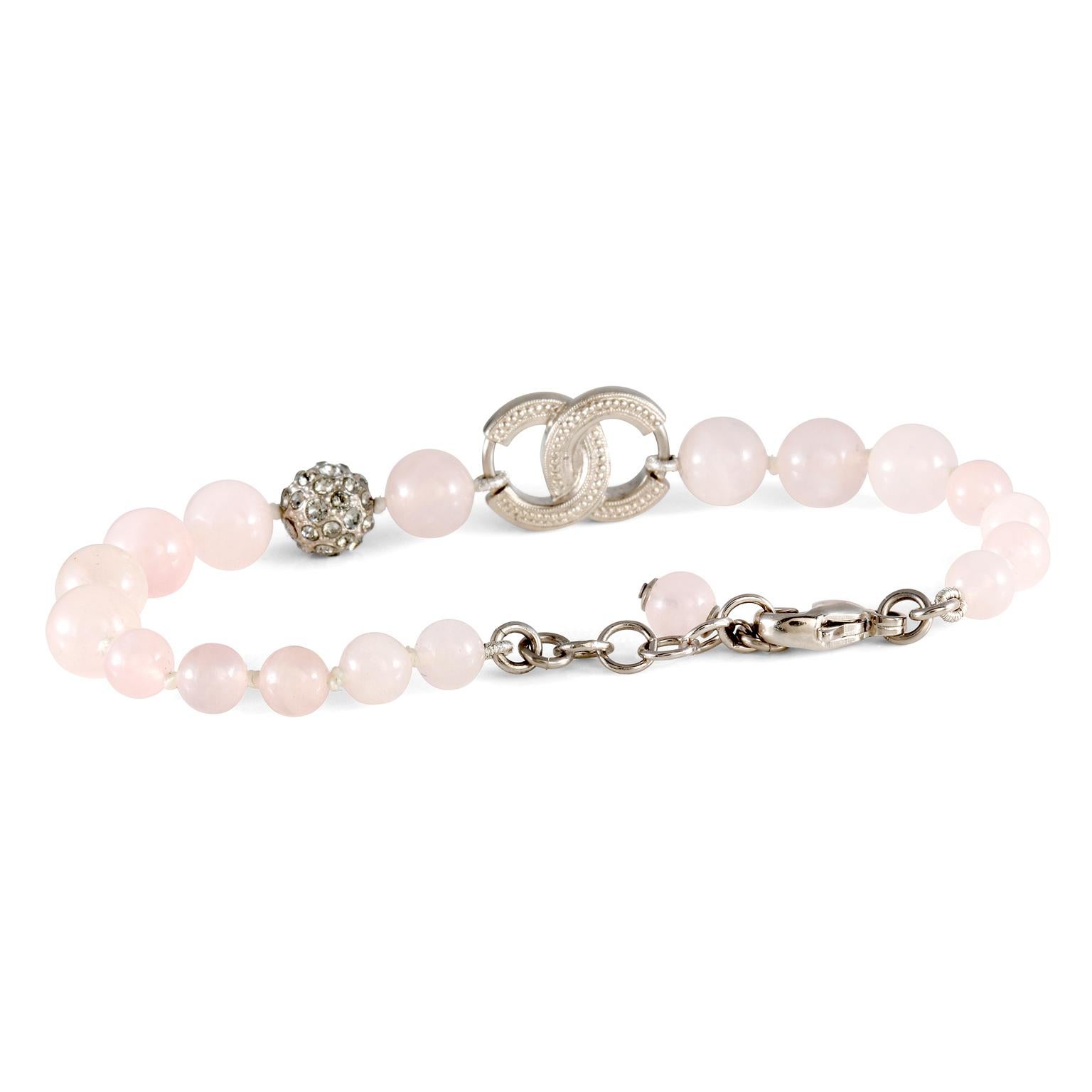 This authentic Chanel Rose Quartz CC Beaded bracelet is in excellent condition.  Soft pink rose quartz beads with silver tone crystal interlocking CC.  Adjustable length approximately 7 inches.  Made in France.  Pouch or box included.

 
