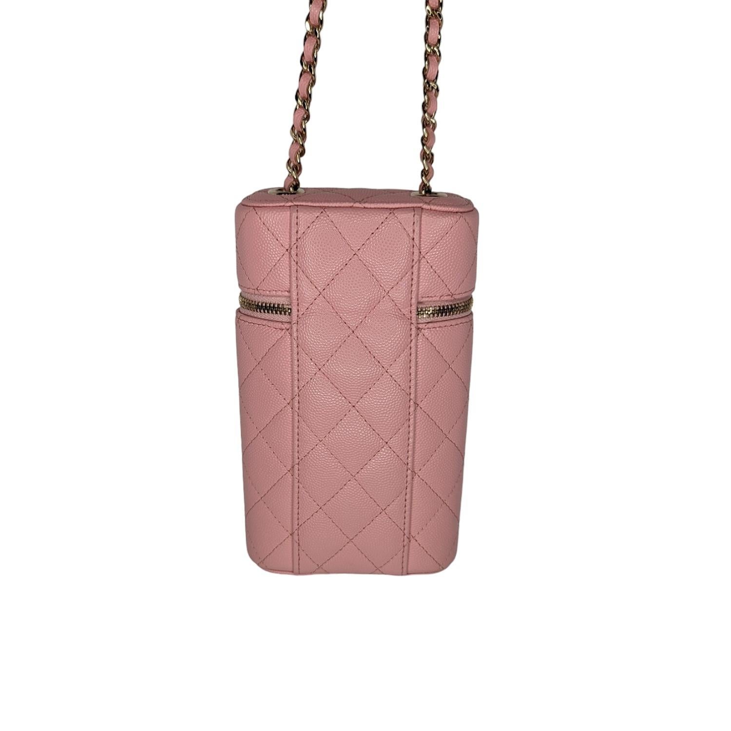 This chic bag is crafted of luxurious diamond quilted leather in bubble gum pink. It features a leather threaded gold chain link shoulder strap and a gold CC logo on the front. The top zipper opens to a matching fabric interior.

Designer: