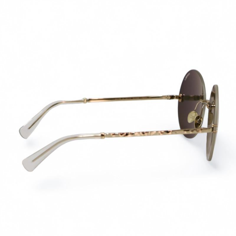 Condit : très bon
Fabriqué en Italie
Matériau :  métal doré
Couleur : or
Dimensions : diamètre du verre 6 cm, longueur des branches 14,5 cm, largeur de la face avant 14 cm
Quincaillerie : métal finition or clair
Tampon : oui
Détails : lentilles