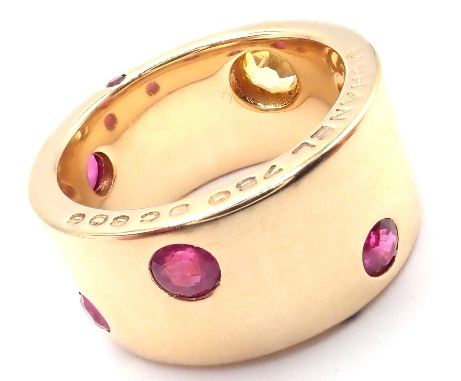 18k Yellow Gold Ruby And Yellow Sapphire Wide Band Ring by Chanel. 
With 1 Yellow Sapphire totaling .10ct
6 rubies 3mm each
1 small ruby on the side
Details: 
Ring Size: 5
Width: 10mm
Weight: 16.5 grams
Stamped Hallmarks: Chanel 750 9C606 1A1251