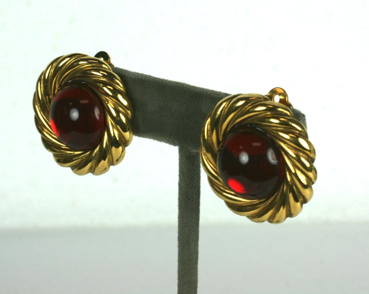 Chanel Ruby Cabochon Earring from the 1990's. Twisted gold surround with ruby Gripoix pate de verre handmade cabochons.
Signed Chanel. Clip back fittings.
Excellent condition. 1.25