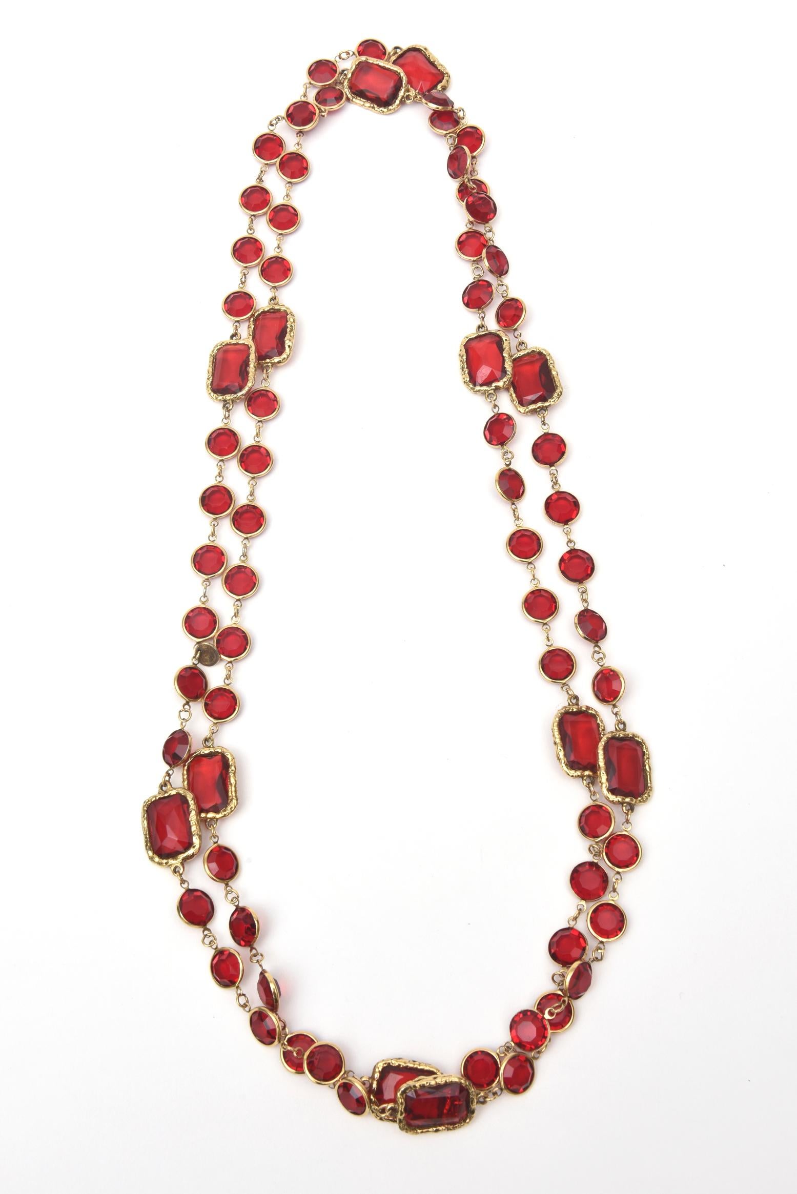 This stunning vintage long Chanel ruby red crystal and gold tone chicklet sautoir long necklace has bezel set crystals. It is vintage and from 1981. This is when Chanel produced these first. This is now a unique and a Chanel rarity. It is signed and