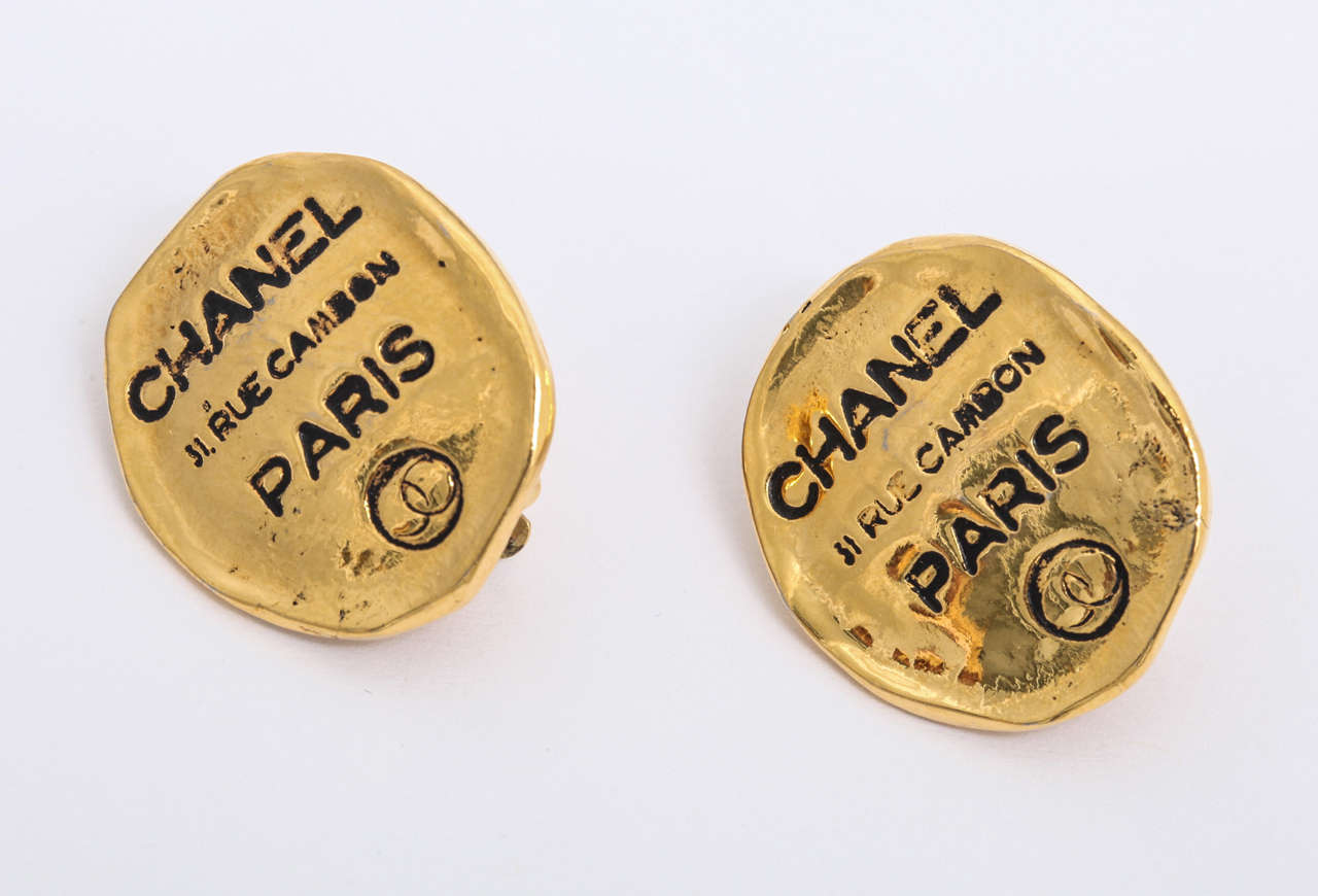 Chanel clip-on earrings with iconic Rue Cambon address.