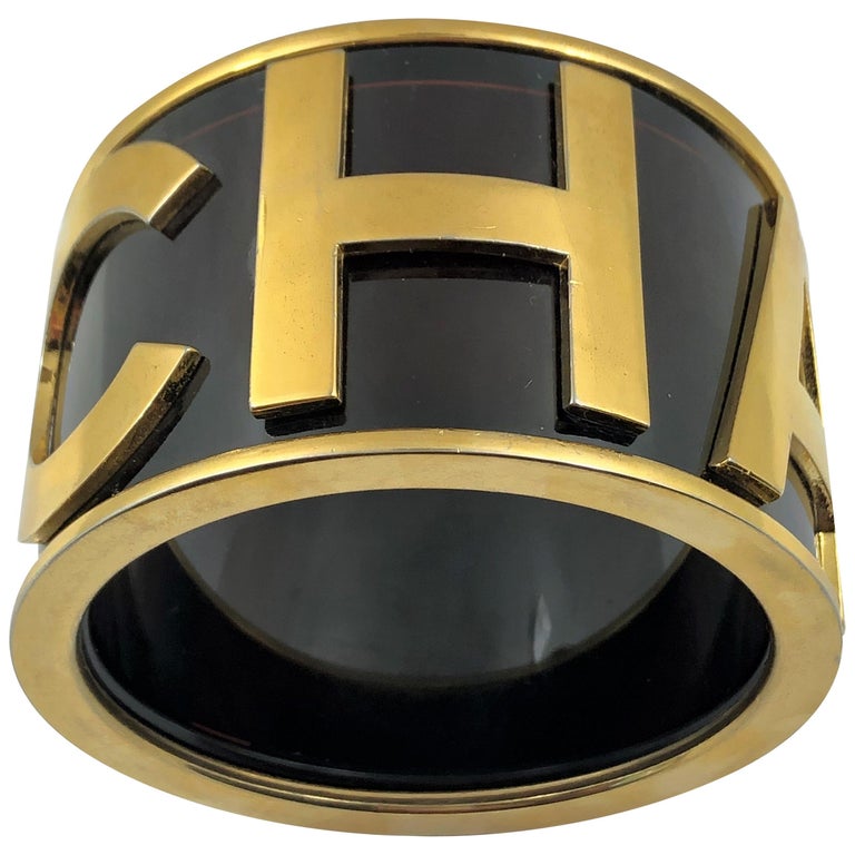 Chanel Runway 1986 Large Black Cuff With CHANEL Spelled out in Gold Tone at  1stDibs