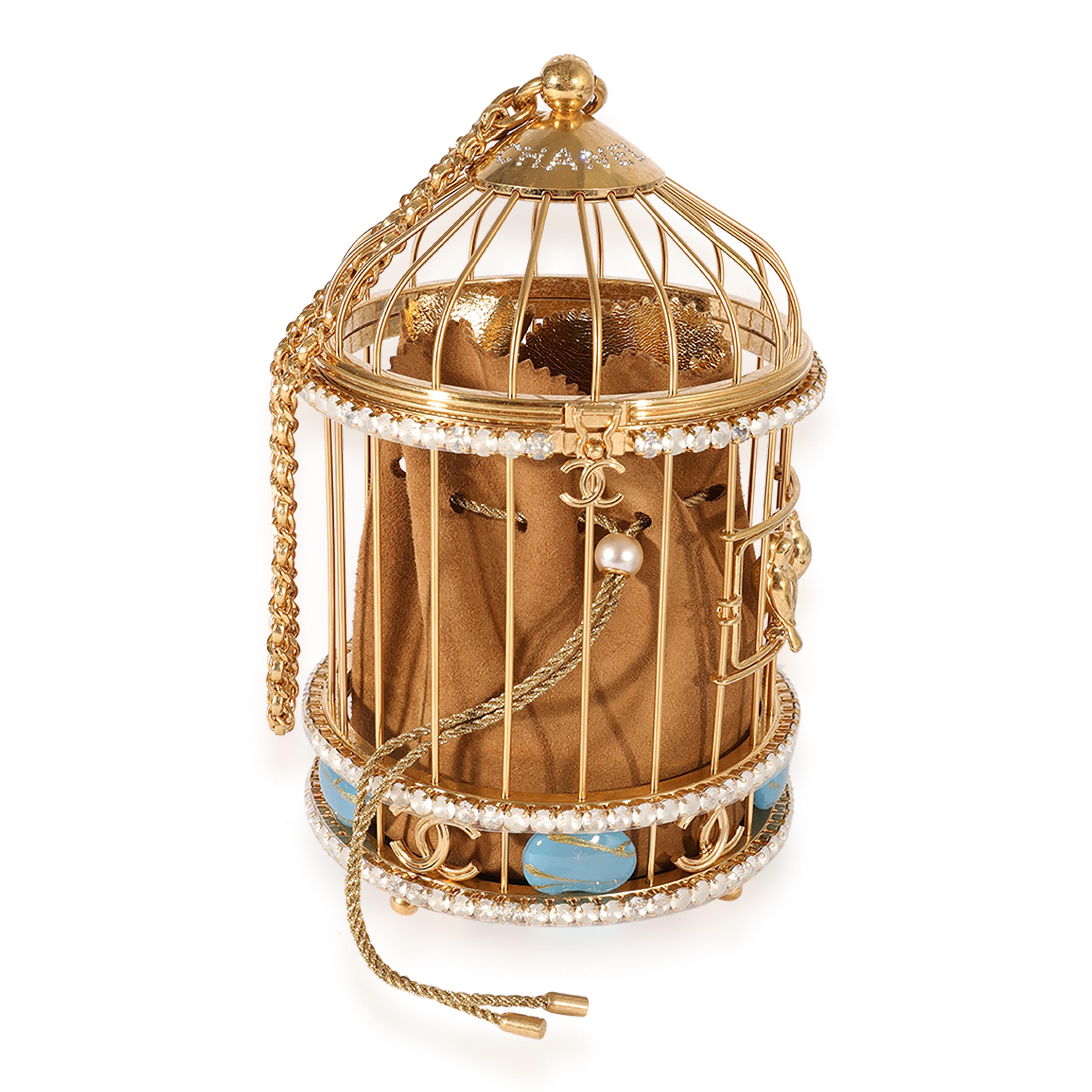 Listing Title: Chanel Runway Gold-Tone Metal & Crystal Bird Cage  Minaudière
SKU: 123609
MSRP: 20500.00
Condition: Pre-owned 
Handbag Condition: Mint
Condition Comments: Mint Condition. Plastic on some hardware. No visible signs of wear. Final