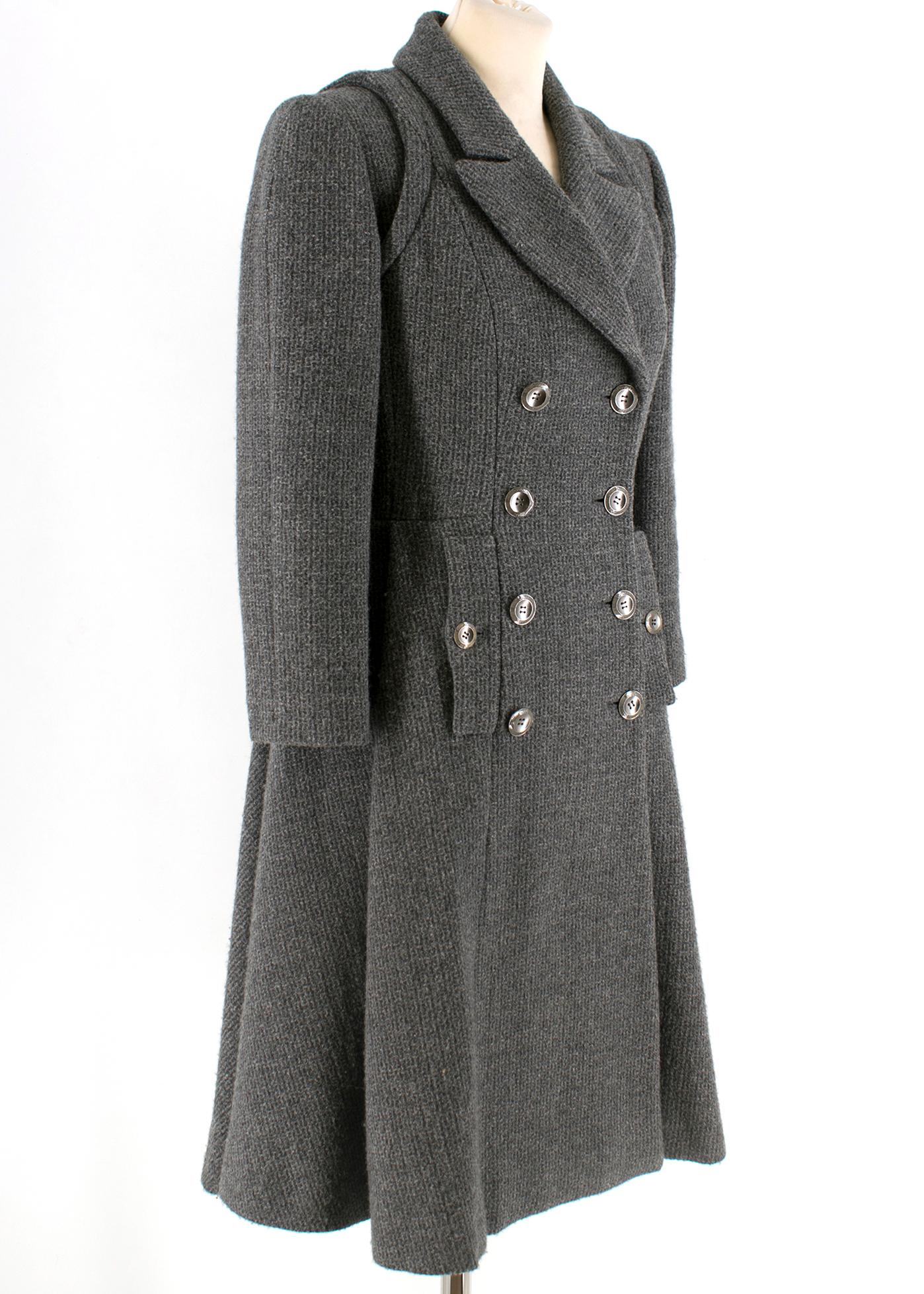 Chanel Runway Grey Wool & Cashmere Coat

- Grey knit long coat 
-  100% silk lining 
- Side buttoned pockets 
- Silver hardware 

Please note, these items are pre-owned and may show signs of being stored even when unworn and unused. This is
