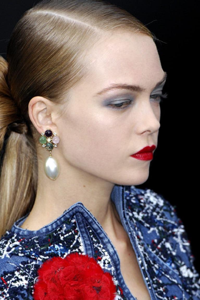 CHANEL runway dangling earrings (clip-on) featuring multicolor resin cabochons, CC logo, clear crystals and a large faux pearl drop in a pale gold toned setting.

As seen on the CHANEL Spring/Summer Ready-to-Wear 2008 runway.

Embossed CHANEL 08 P