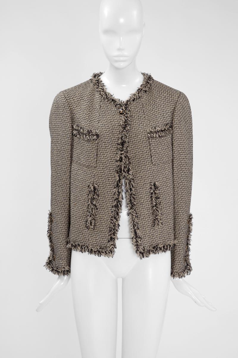 From the 2007 Spring-Summer Chanel ready-to-wear collection, this jacket appeared in the look number 41 of the fashion show (see picture 3). Cut from traditional woven tweed, the fabric is enriched with gold Lurex thread providing a luxurious feel.
