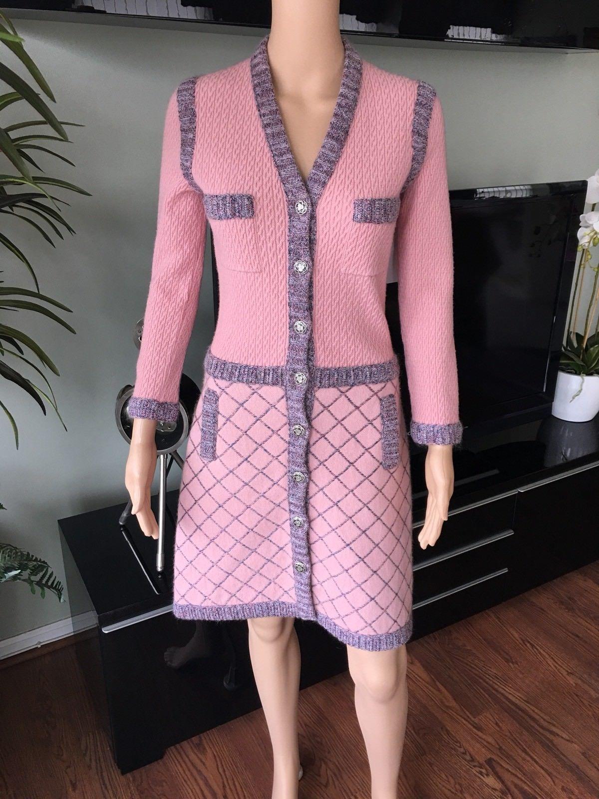 Chanel cashmere-blend heavy knit knee-length dress with dual patch pockets at bust, diamond pattern at skirt featuring dual pockets at hips and interlocking CC camellia button closures at center front. Condition - Like New Flawless 

ABOUT