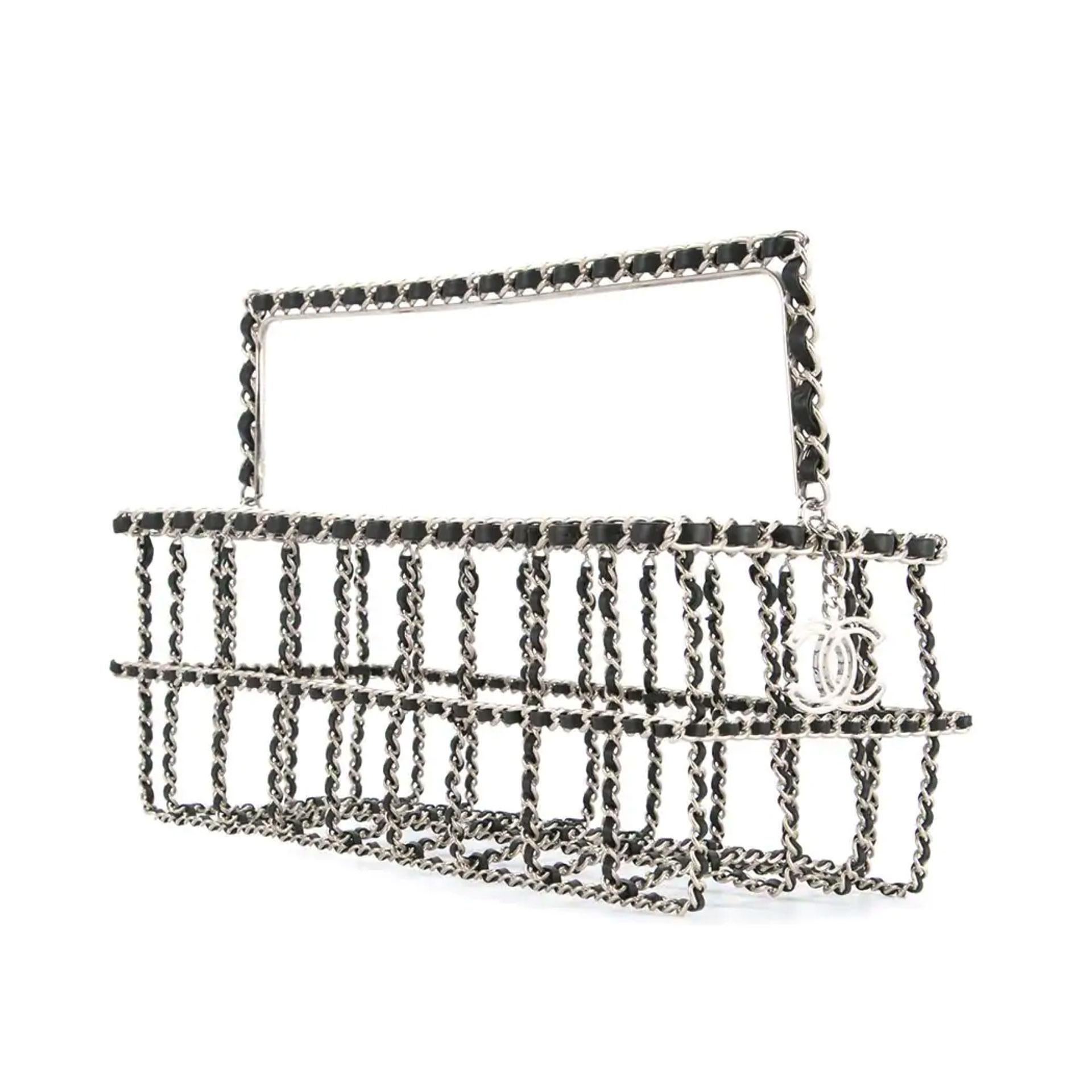 Chanel classic silver interwoven chain in the form of a rectangle sized grocery shopping basket

Fall 2014
Silver hardware
Classic interwoven chain
CC Silver Charm
Can be used for high fashion or interior decor
Handle drop: 3.1