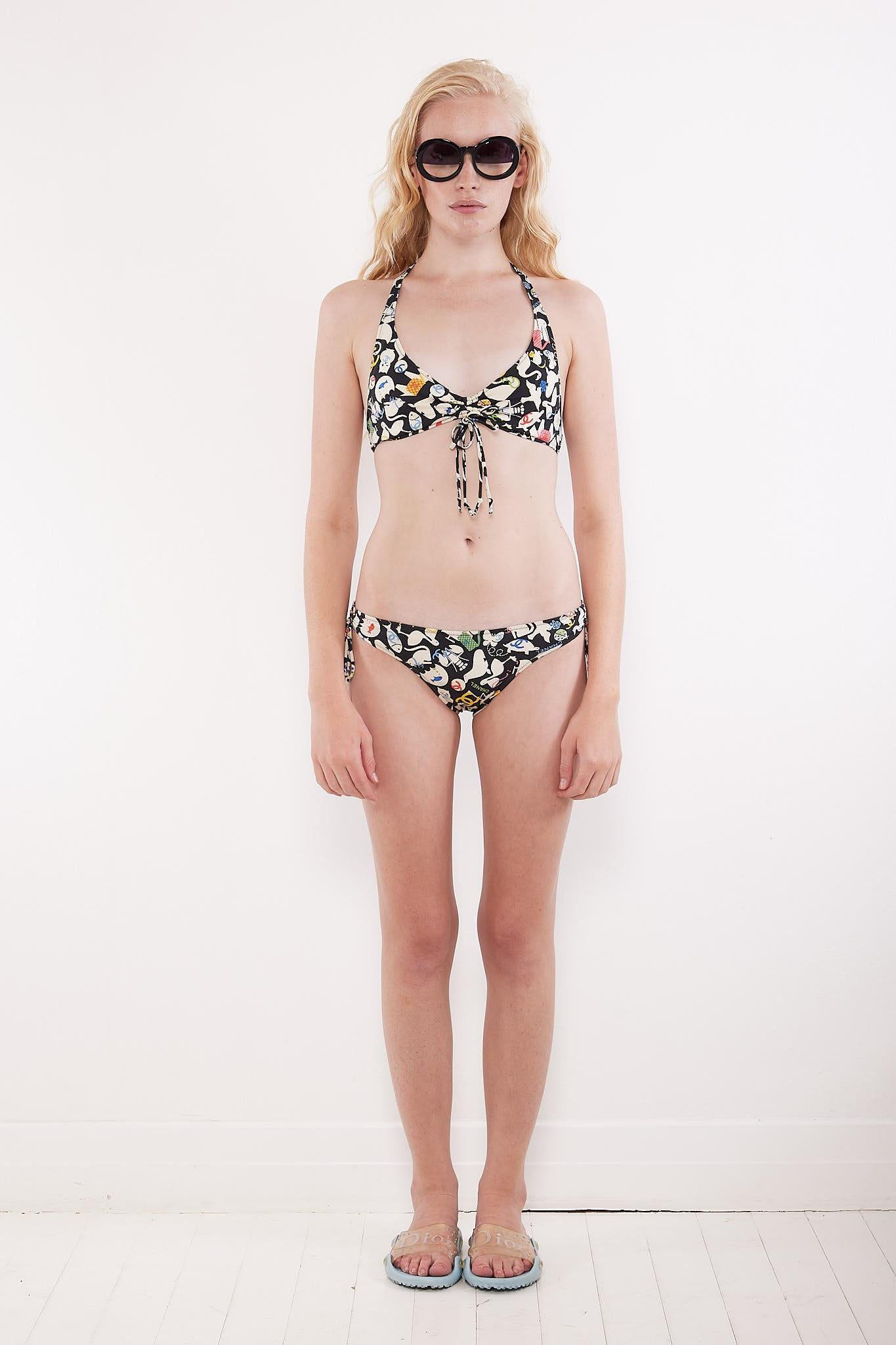 Dating to the S/S 2007 collection, this Karl Lagerfeld designed bikini features an adorable graphic print incorporating different animals & CC logos in a monochrome colour scheme with pops of pink, blue, yellow & green. Comprising a halter style top
