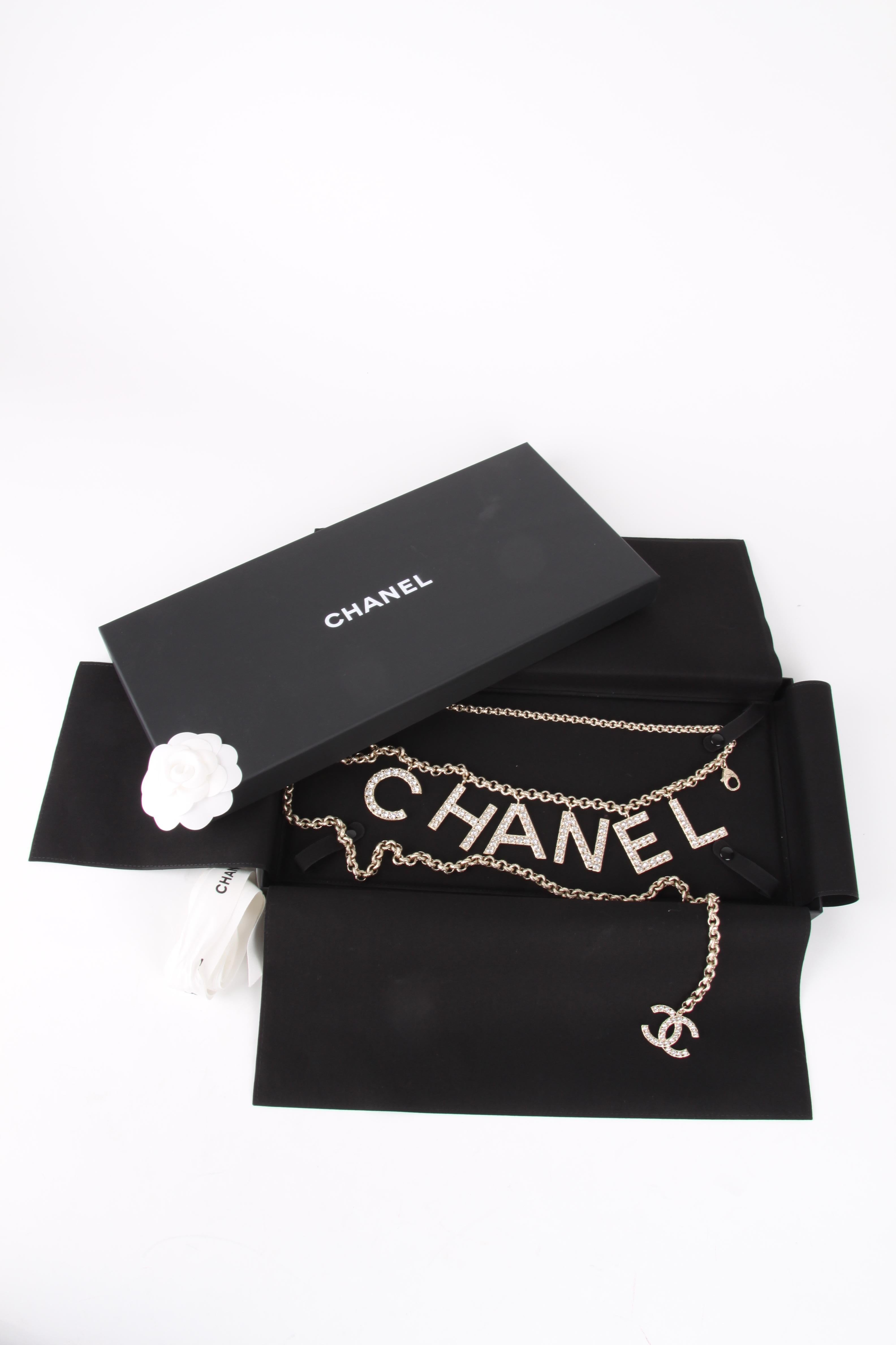 Chanel Chain Logo Belt from the Sping/Summer Collection Of 2019.

SOLD OUT WORLD WIDE.

This stylish belt is a gold tone chain with crystal CHANEL letters and a Chanel CC at the end with the timeless quality and style only from Chanel! Most sought
