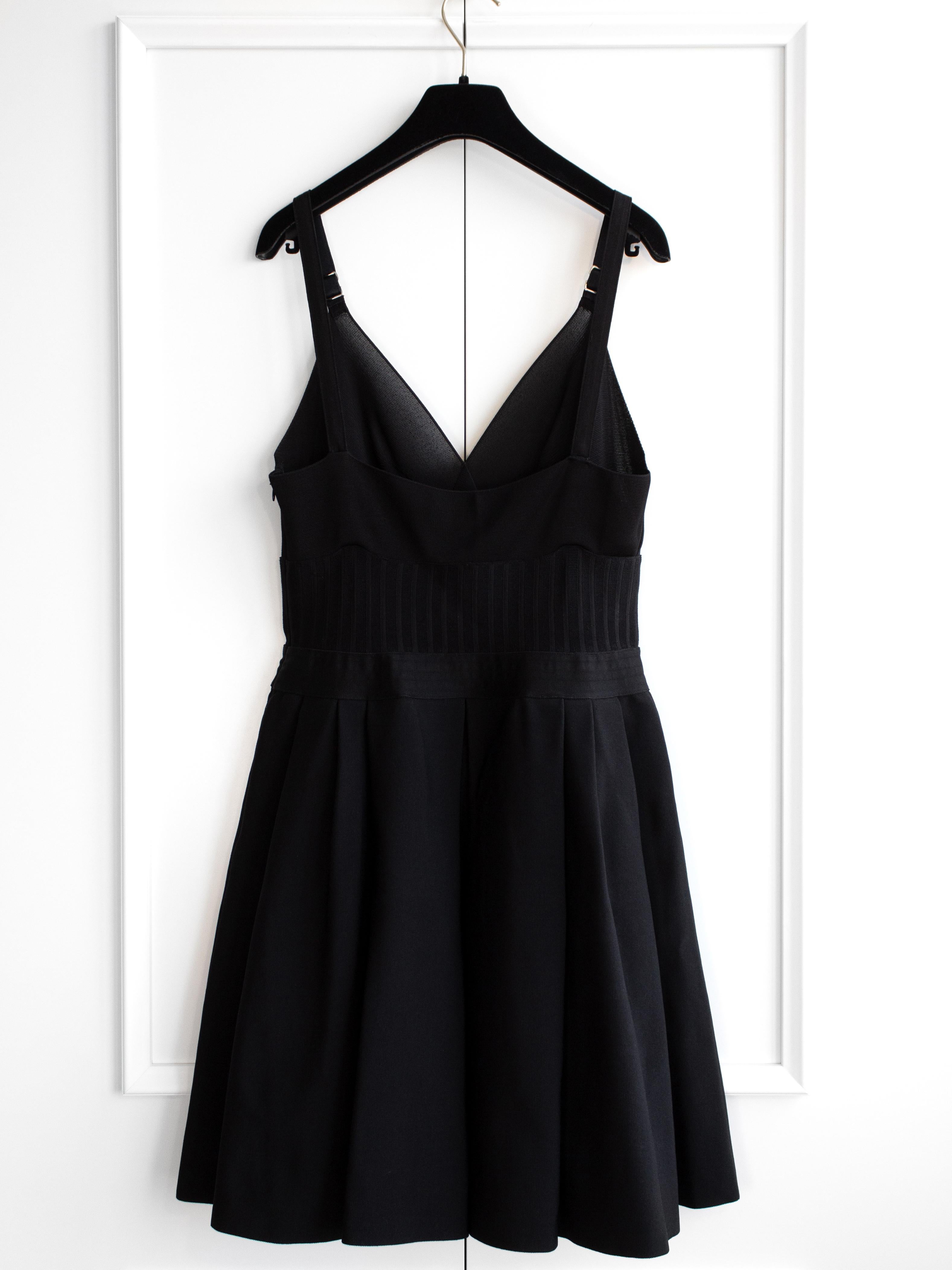 The little black dress from Chanel's Spring/Summer 2020 is a celebrity and blogger favorite, featuring a crystal CC logo on the straps. Its corset-like knitted bodice enhances the waist, while the A-line silhouette and mini length add a hint of
