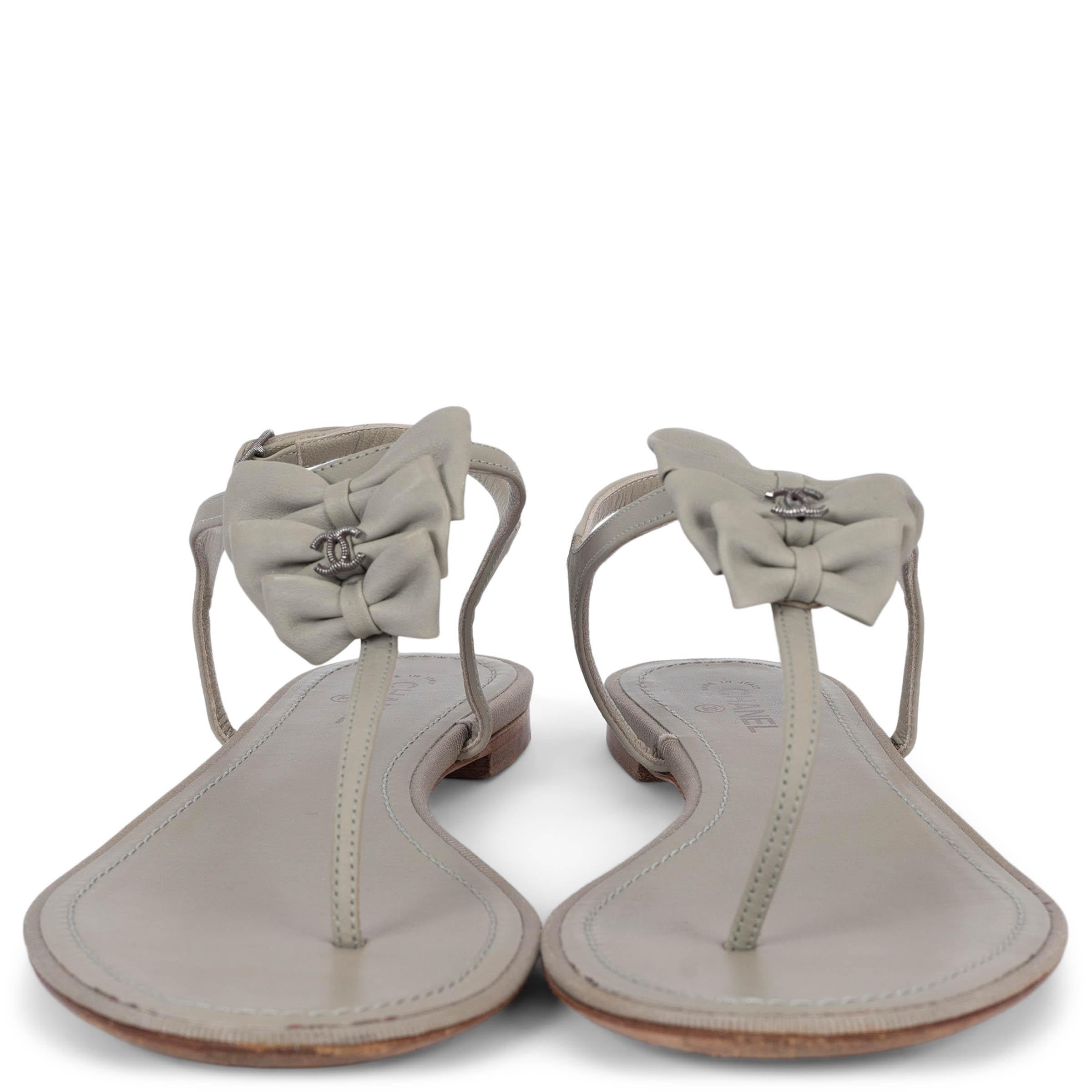100% authentic Chanel bow embellished thong sandals in smooth sage green leather featuring gunmetal CC logo and buckle. Have been worn and are in excellent condition.

2013 Pre-Spring 

Measurements
Model	13P G28974
Imprinted Size	37.5
Shoe