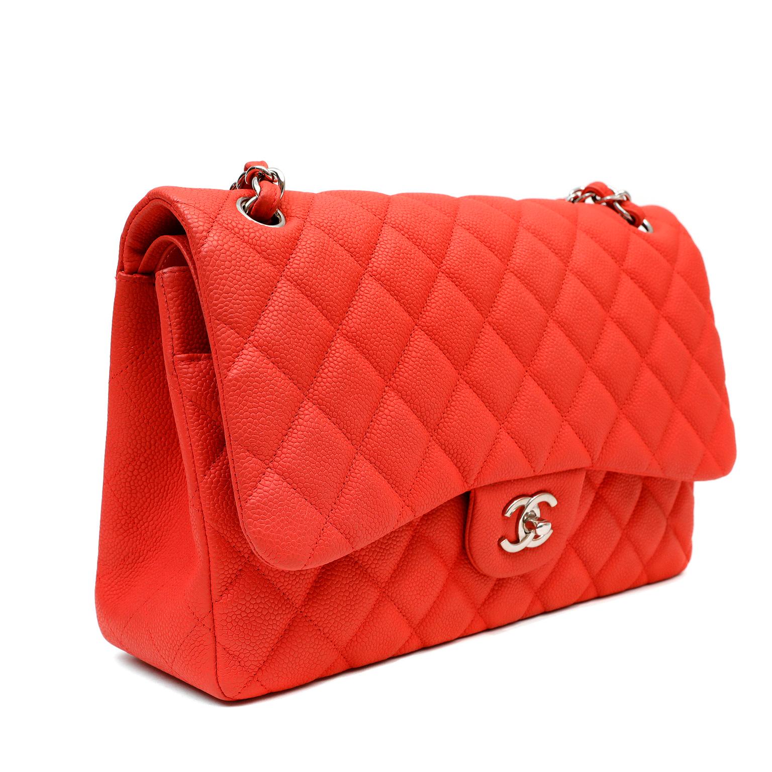 This authentic Chanel Salmon Brushed Caviar Jumbo Classic is in pristine condition.  Durable and textured brushed salmon colored caviar leather is quilted in signature Chanel diamond pattern.  Silver interlocking CC twist lock secures the exterior