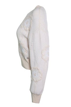 Chanel, salmon coloured knitted camellia sweater