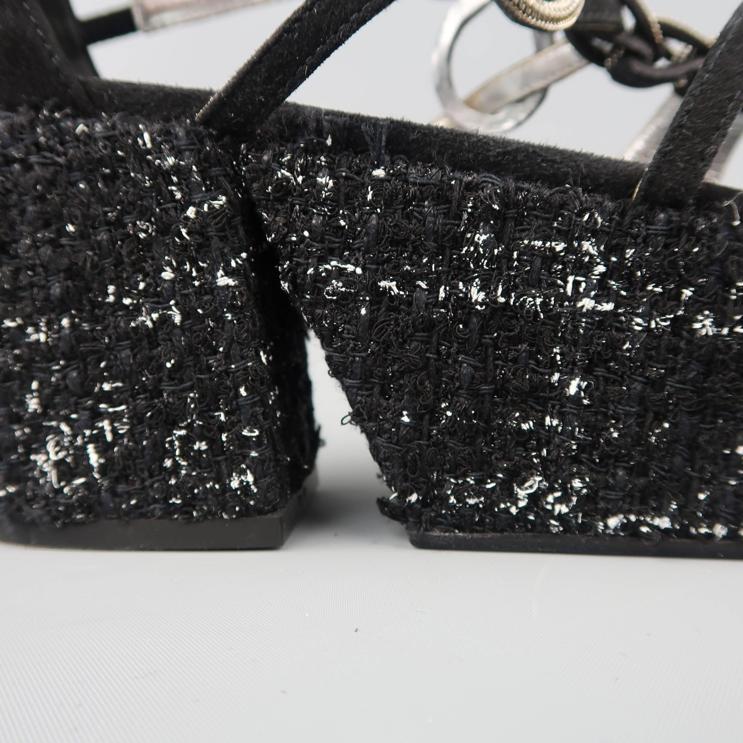 CHANEL gladiator style sandals come in black suede with metal details and thick tweed covered platform wedge sole. Made in Italy.
 
Good Pre-Owned Condition.
Marked: IT 40
 
Measurements:
 
Heel: 3 in.
Platform: 2 in.

