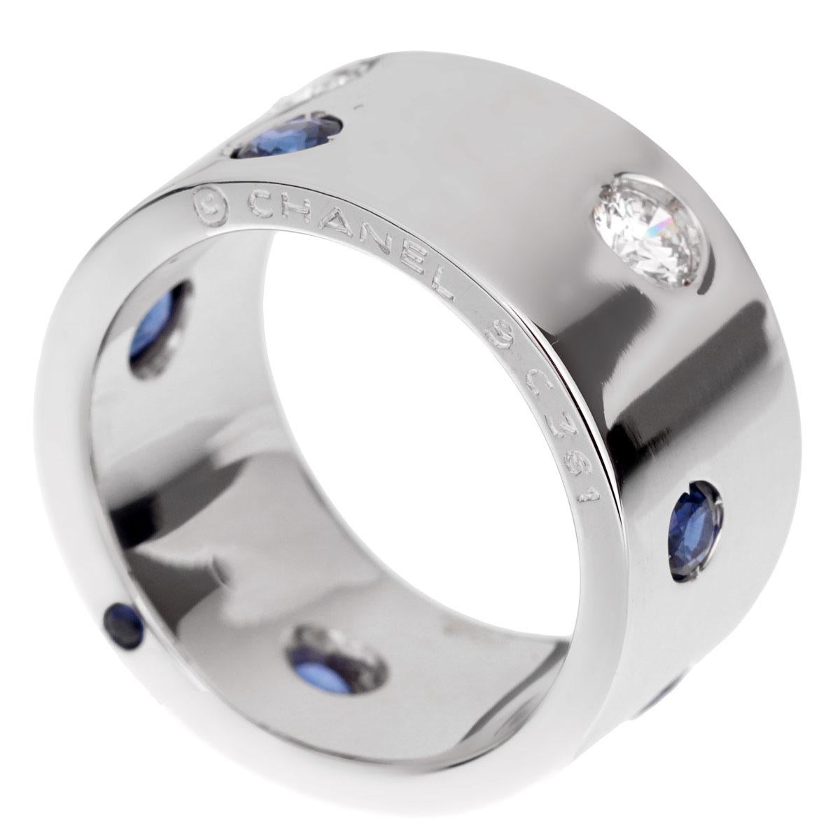 A fabulous Chanel band style rind showcasing 2 round brilliant cut diamonds and 6 sapphires set in 18k white gold. The ring measures a size 6 1/4

Width: .39