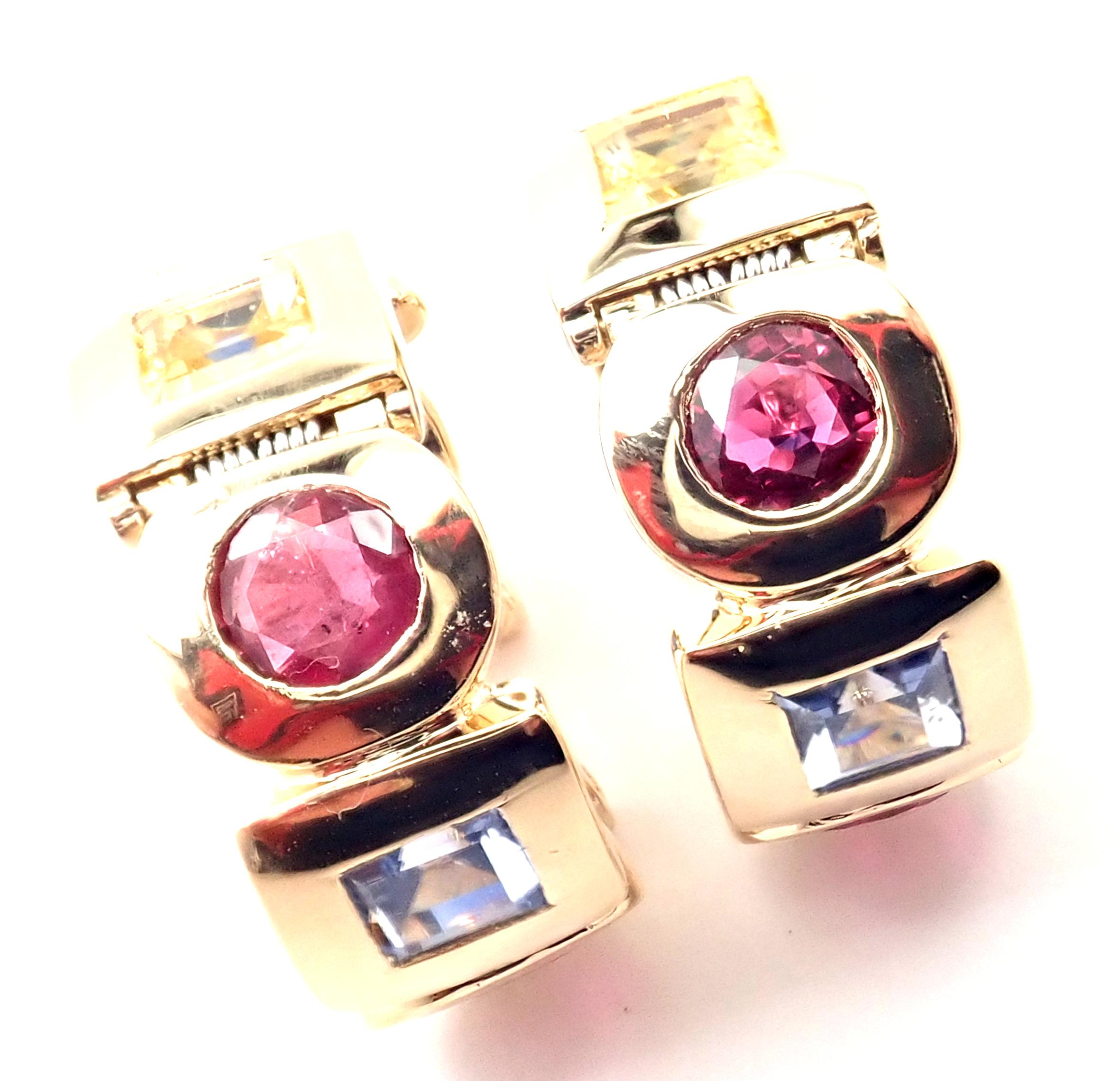 18k Yellow Gold Sapphire Ruby Citrine Hoop Earrings by Chanel. 
With 4 Rubies
6 Sapphires
2 Citrines
These earrings are for pierced ears
Details: 
Weight: 26.8 grams
Measurements: 23mm x 9mm
Stamped Hallmarks: Chanel 750 9D1207
*Free Shipping within