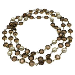 CHANEL SAUTOIR, signed 1981 with handmade pearls and round rhinestons