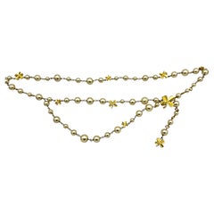 Sautoire ou ceinture CHANEL, 1990, perles faites main avec 9 feuilles de trèfle avec CC's