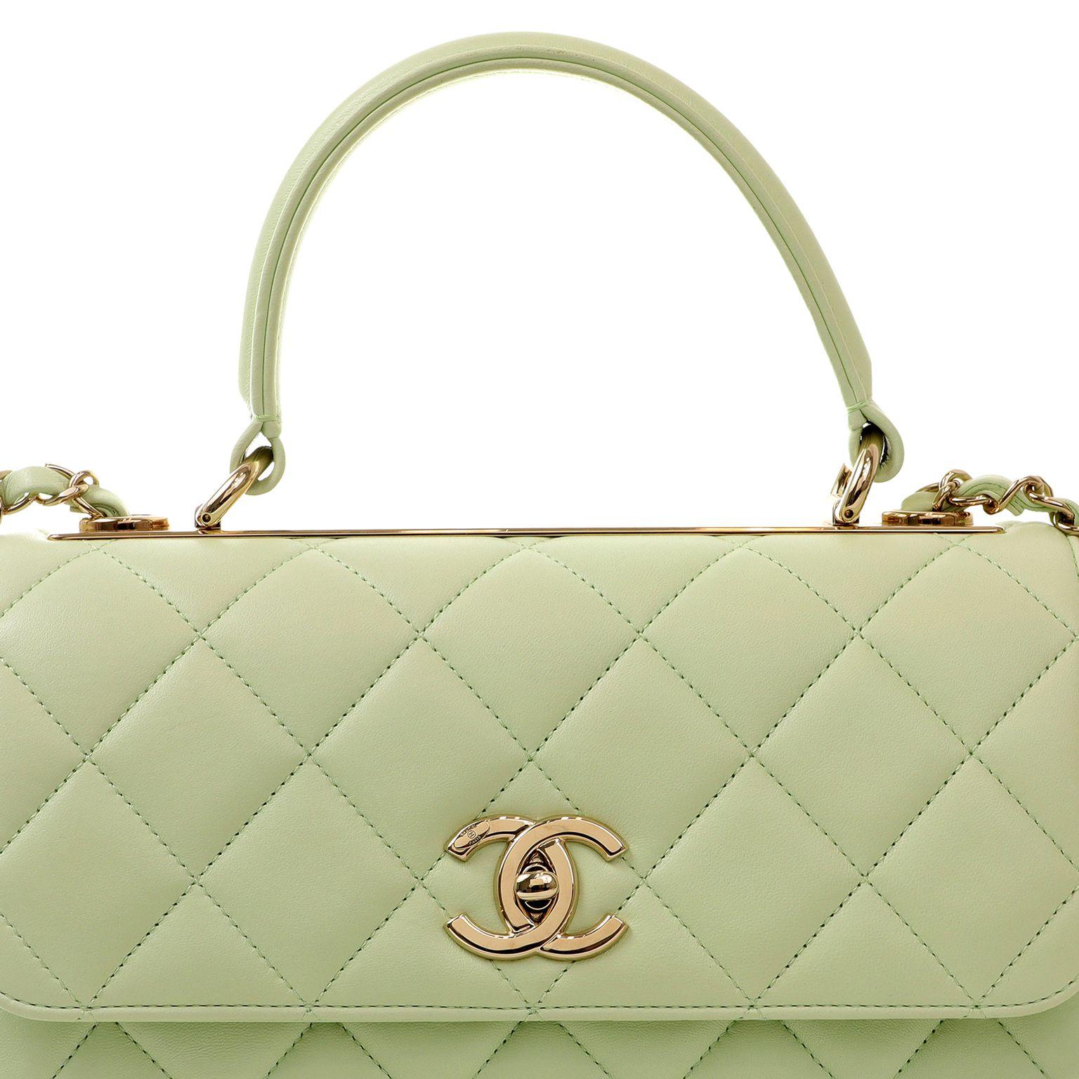 This authentic Chanel Seafoam Green Lambskin Coco Handle Flap Bag is in pristine condition.  Elegant and sophisticated, the Coco handle is an exquisite departure from the Classic Flap silhouette. 

Soft pastel green lambskin is quilted in signature