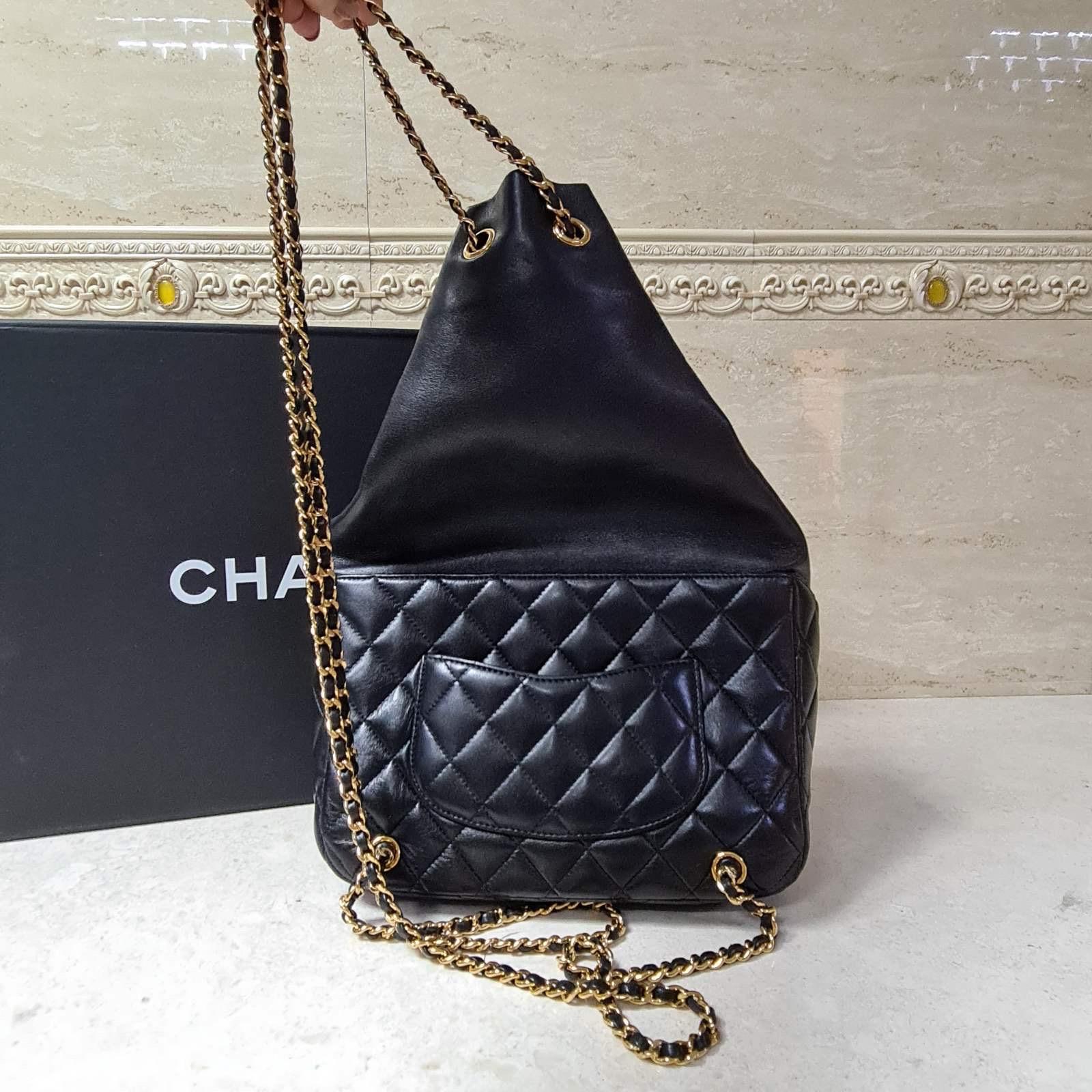 This Chanel Cruise 2015/2016 Seoul Lambskin Backpack has hardly been worn and is suited for any sophisticated collector’s wardrobe. 
The bag features the black signature quilt, golden hardware and comes in a dust bag.
Condition is very good.
For