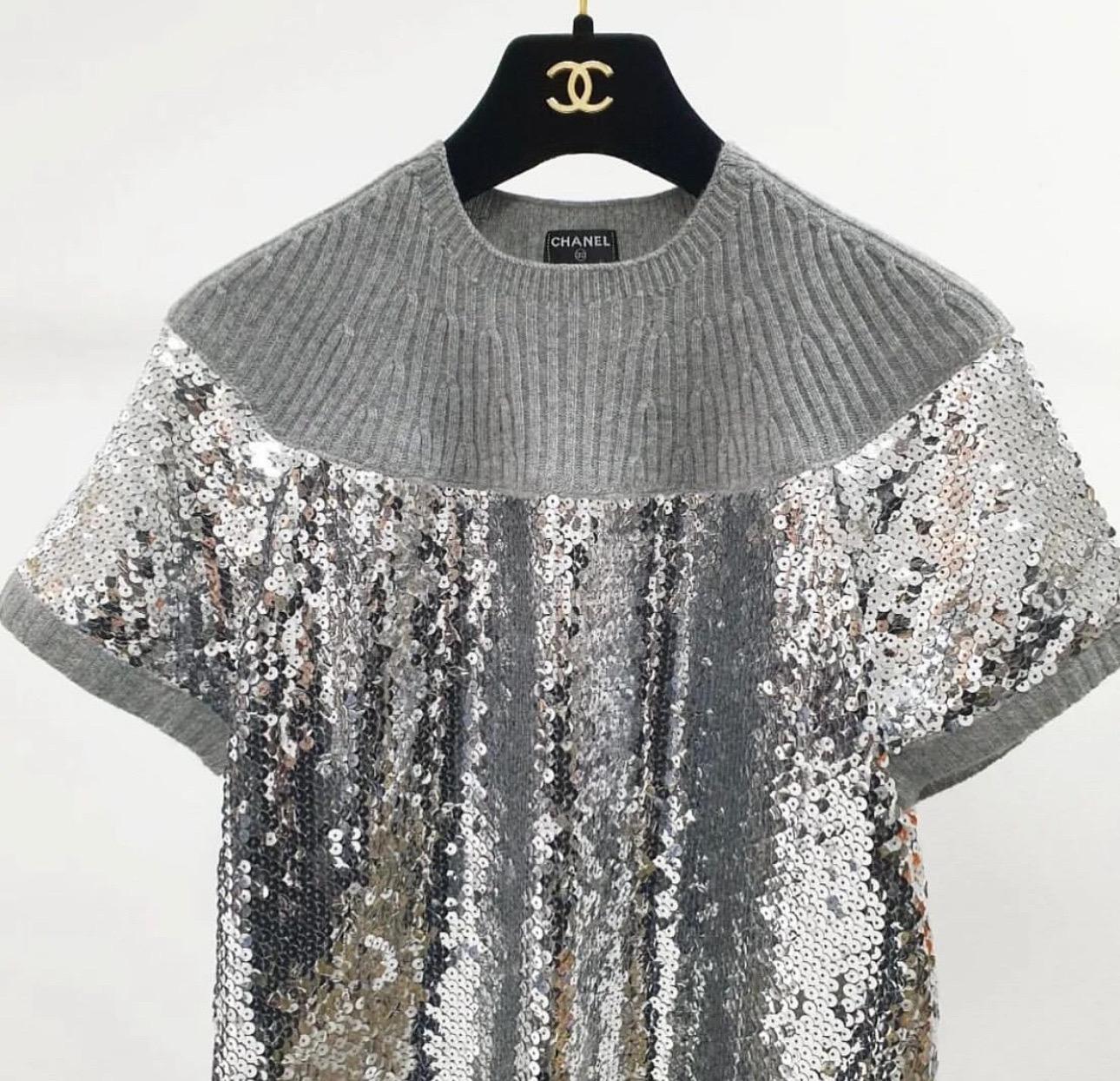  From the Fall 2008 Collection
Silver-tone Chanel sequin knit sweater with crew neck and short sleeves.
Sz.38
Excellent condition.