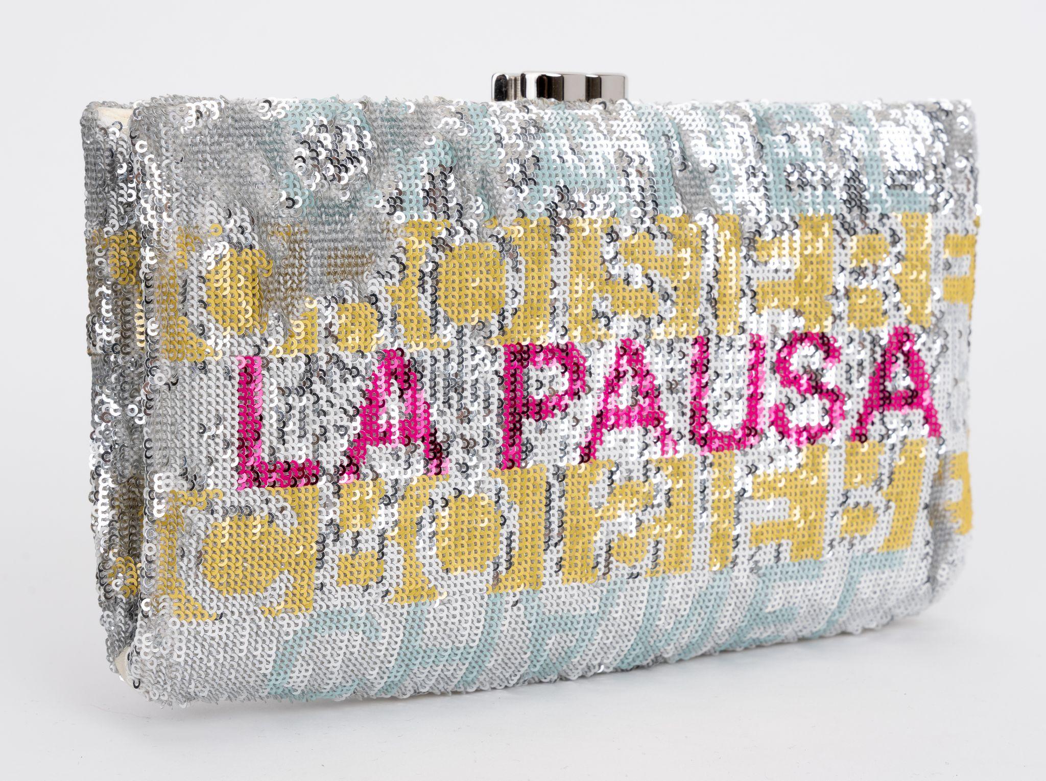 Chanel Sequin Satin Embroidered La Pausa Evening Clutch Silver in Yellow and Pink. The clutch features silver, yellow and pink sequins. The bag opens up to satin lining.
Collection 26. Comes with hologram, id card and original dust cover.