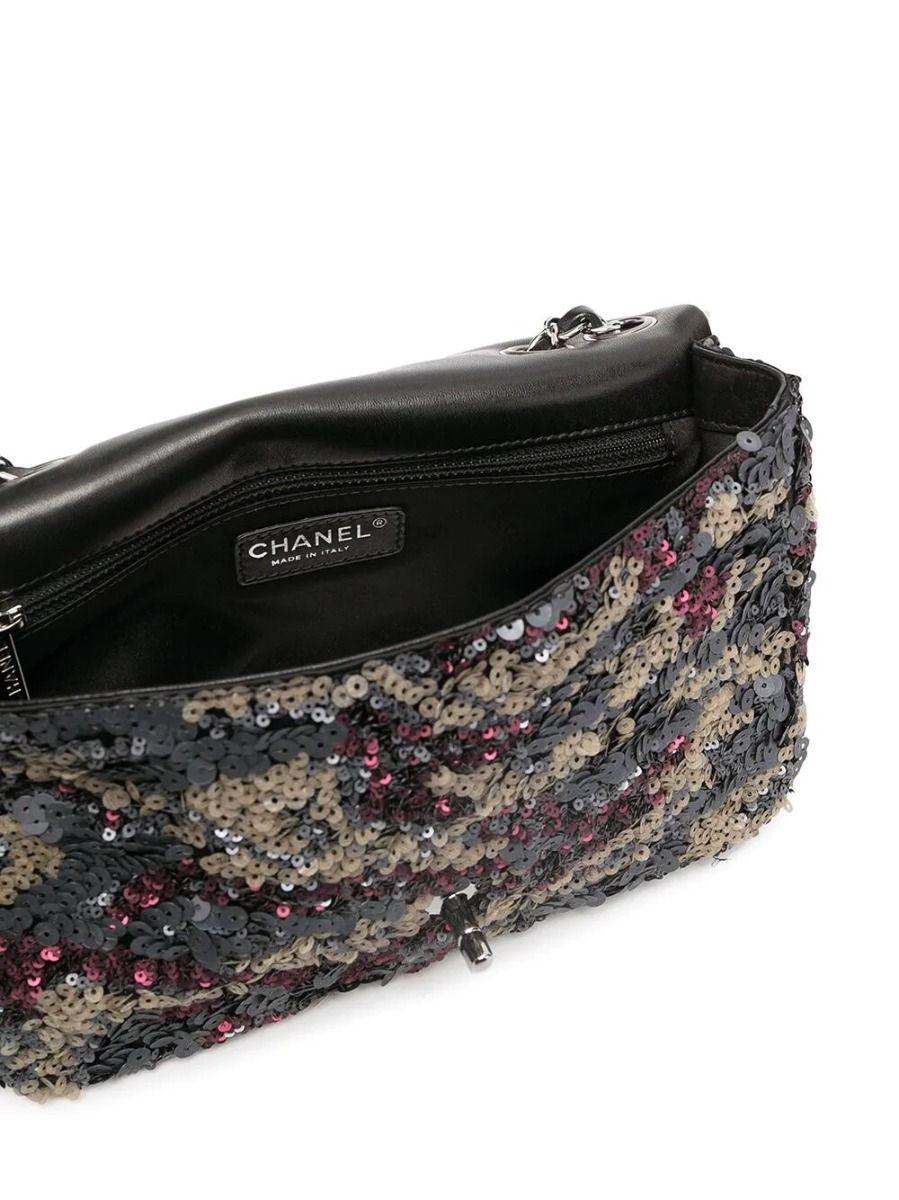 For some added sparkle look no further than this Chanel Classique Sequin bag. Adorned with all-over sequin embellishments in hues of pink and green and finished with the signature interlocking CC turn-lock fastening in silver-tone hardware, this