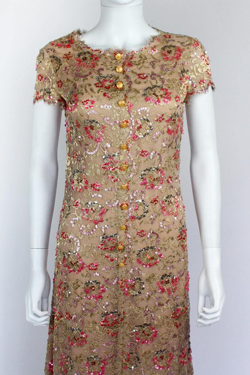 Rare Chanel dress from the Fall/Winter 1996 ready to wear collection, designed by Karl Lagerfeld. As seen on the runway, and almost identical pieces featured in the same seasons Haute Couture collection and advertising campaign. Intricate lace