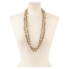 Chanel, ensemble de deux colliers en métal or foncé avec perles de costume, 1983