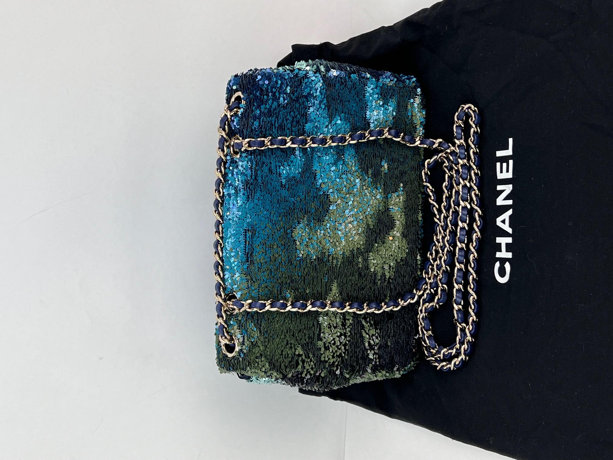 Pre-Owned  100% Authentic
Chanel Shaded Sequins Mini Flap Green, Blue, Black Shoulder Bag 
This Spectacular Shaded Chanel Sequins Bag, will look different from every angle. Take
her out for formal or fun parties, she is ready to be a stand out