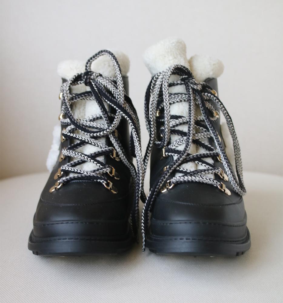 Chanel shearling-lined lace-up ankle boots perfect for the colder days. 
Ankle length. 
CC logo detail in shearling. 
Lace-up fastening. 
Stacked heel. 
Adjustable CC metal guard for grip in the snow. 
Calfskin and shearling lined. 
Fur type: sheep