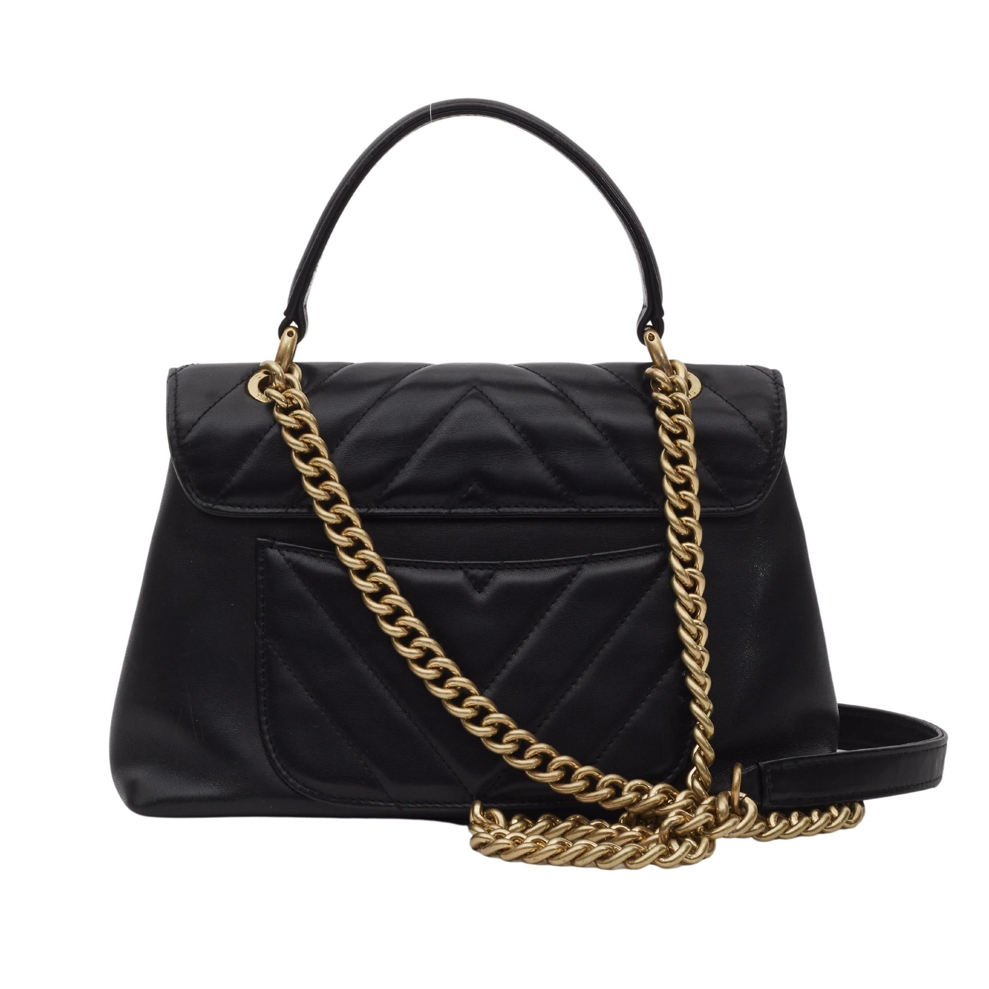 This shoulder bag is crafted of sheepskin chevron stitched leather in black and lined with aged gold chain. The bag features a sturdy leather looping top handle, shoulder chain with a leather shoulder pad and a bold aged gold Chanel CC turn lock.