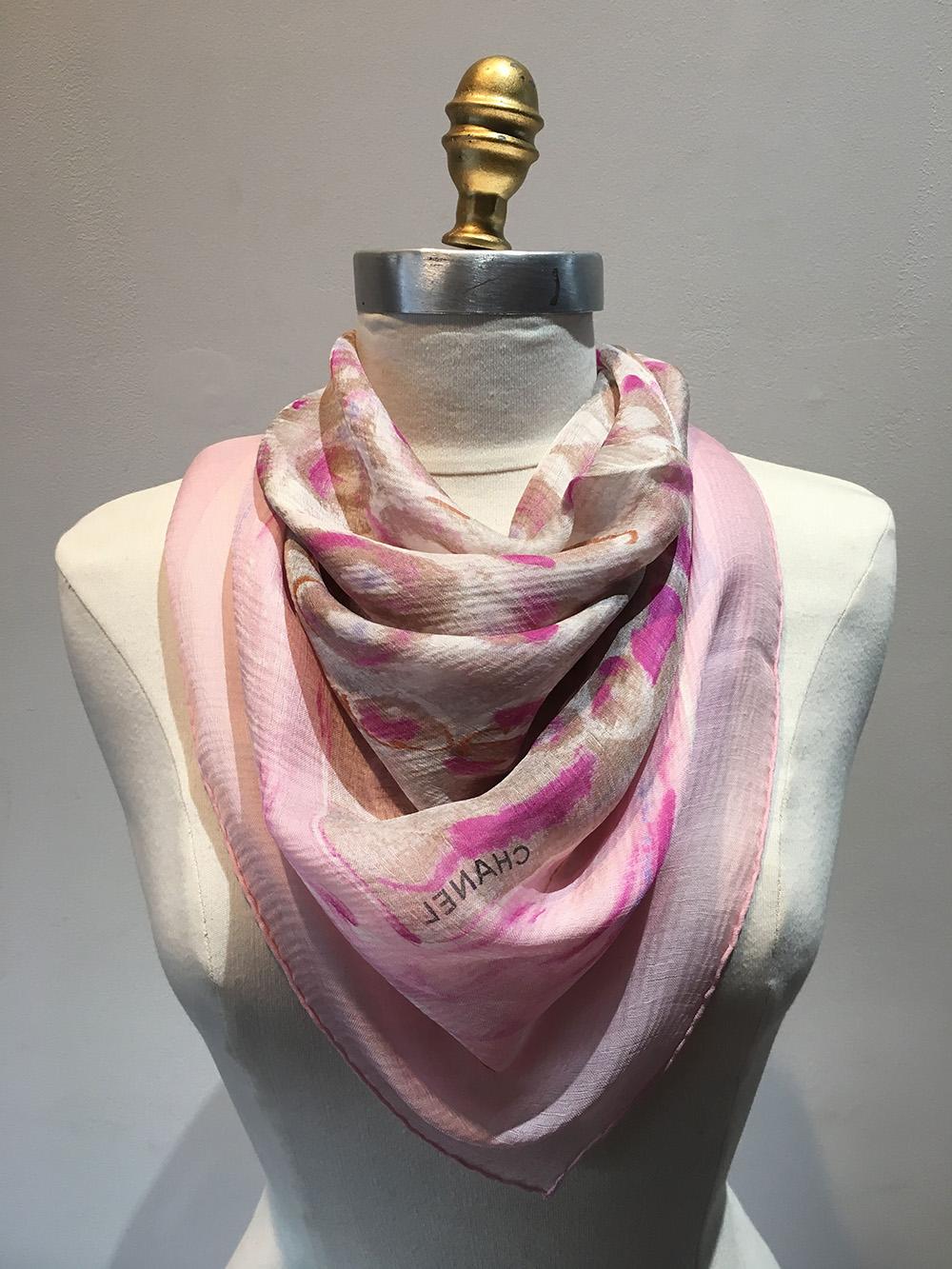Chanel Sheer Pink Silk Scarf in excellent condition. Pale pink with dark pink, grey, white and blue abstract print. Chanel printed on each side. No stains smells or fabric pulls. Sheer silk. Measures 37