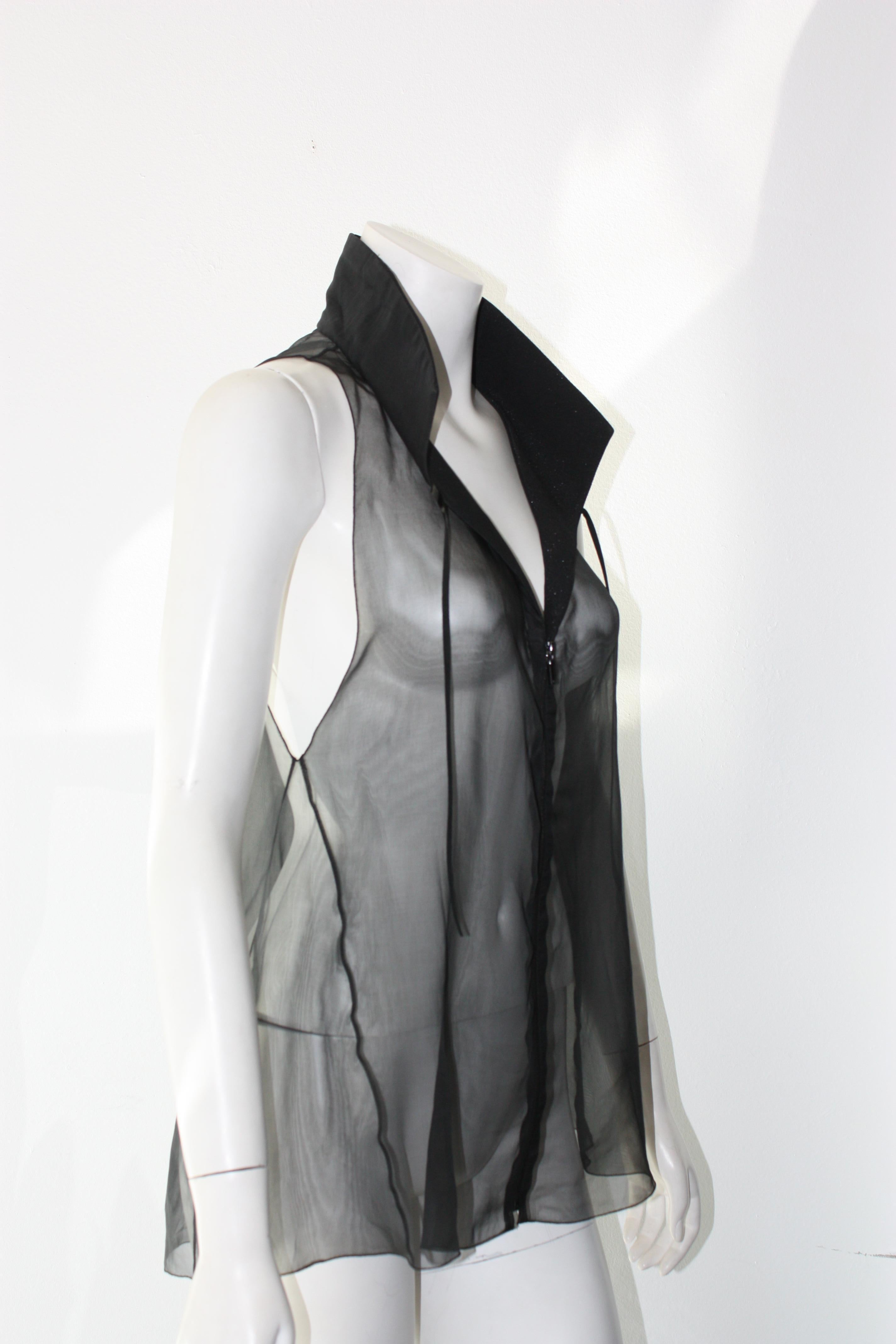 CHANEL Black, Sheer, Sleeveless, Collar Blouse. 
 Zip up blouse with pleather tie strings. 
Collared with a swing shape. 

100% silk. Collar: 71% wool, 23% silk, 6% nylon.

Size 36.
Great Condition. Model is wearing with black camisole. 