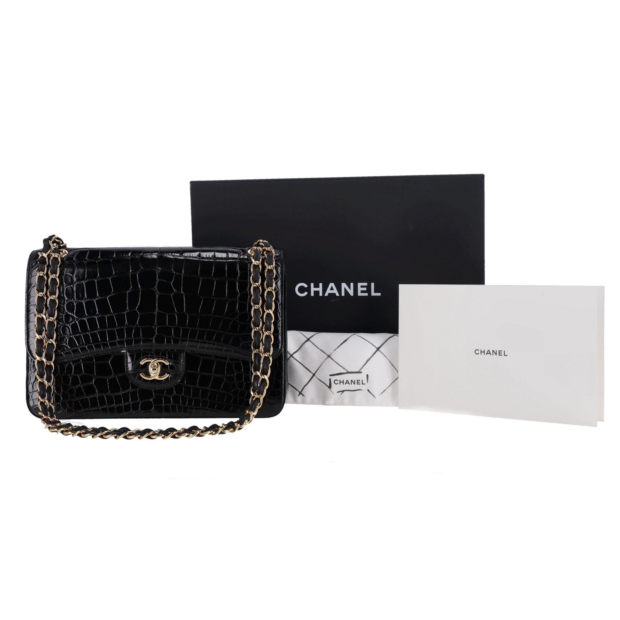 Rare Item - Chanel Shiny Alligator Jumbo Double Flap Bag

Shiny black iconic handbag crafted in Alligator skin and gold hardware.

Double front flap and signature 'CC' turn-lock closure.

Intertwined chain-link strap and open pocket to