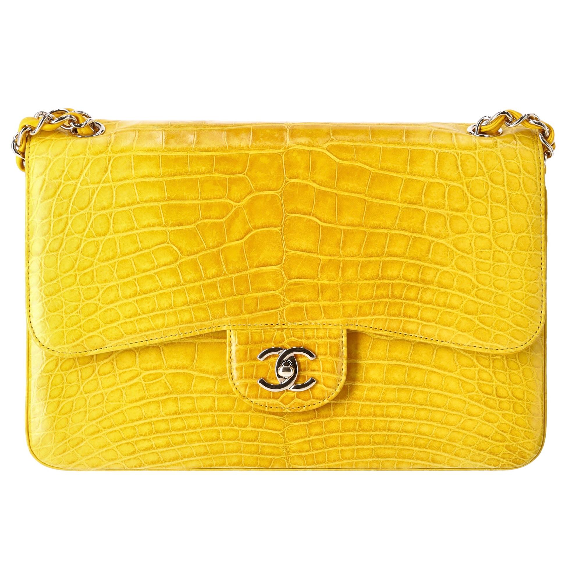 Rare Item - Chanel Shiny Alligator Skin Jumbo Double Flap Hand Bag

Shiny saffron yellow timeless handbag crafted in Alligator skin and silver hardware.

Double front flap and signature 'CC' turn-lock closure.

Intertwined chain-link strap and open