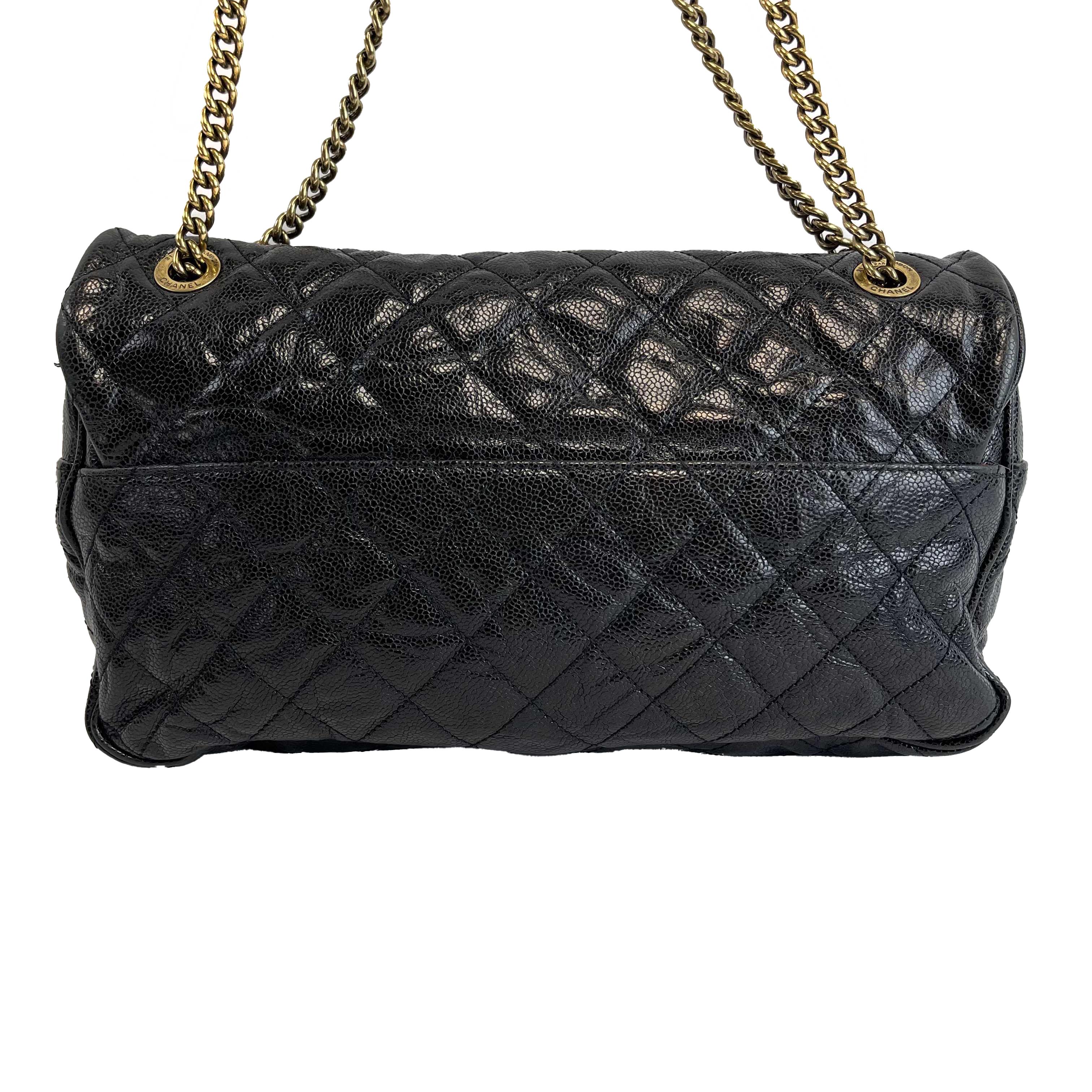 Chanel - Shiva Flap Bag Quilted Caviar Large Black CC Shoulder Bag
Measurements

Width: 12.5 in / 31.75 cm
Height: 6 in / 15.24 cm
Depth: 3 in / 7.62 cm
Strap Drop: 19 in / 48.26 cm
Handle Drop: 10.5 in / 26.67 cm
Details

Made In: Italy
Color: