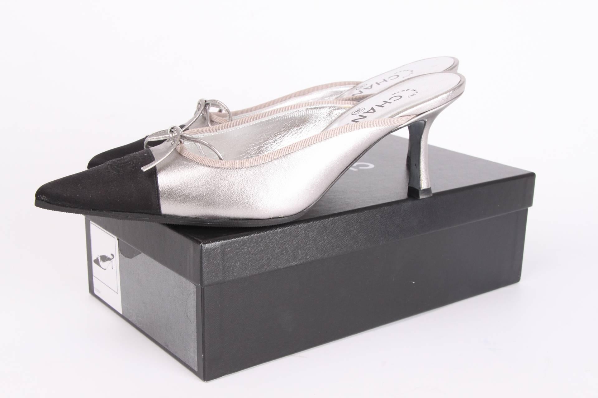 These are super hot! Perfect pair of Chanel shoes in metallic silver-tone leather with a tiny kitten heel!

A pointy toe crafted in black satin with a CC logo, a silver-tone bow on top of that. The heel measures 8 centimeters. A silver-tone leather