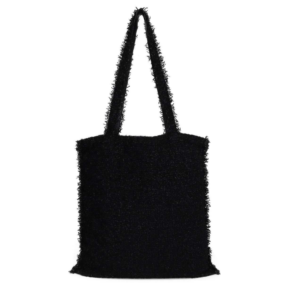 CHANEL Shopping in Fabrics Black Tweed Robot Tote Bag with Silver-Tone Hardware 2017 – 17S.

This stunning tote is still in very good condition, and the hardware is still very clean and shiny.

- Exterior Condition: Very good condition; Outside of