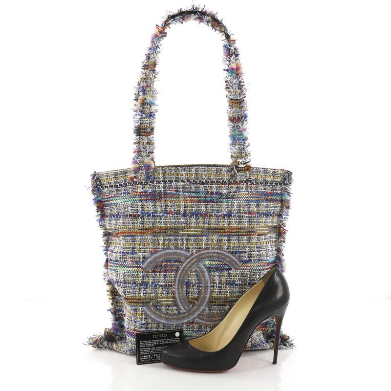 This Chanel Shopping Tote Embellished Tweed Large, crafted in multicolor embellished tweed, features dual top tweed handles and silver-tone hardware. It opens to a gray quilted fabric interior with slip pocket. Hologram sticker reads: 25275223.