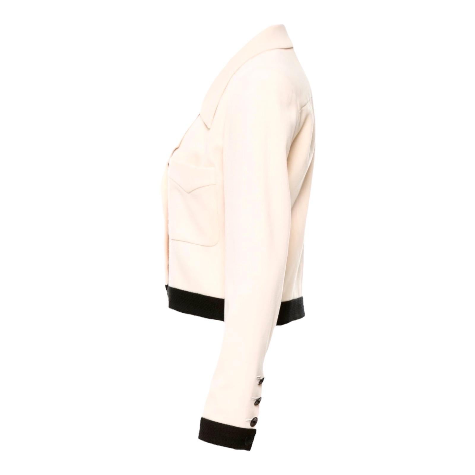Stunning Piece by Chanel
Classic Jacket 
Chanel bi-color signature monochrome design
Fantastic light colored fabric 
Black tweed fabric trimmings
Two front pockets
Sleeves with Chanel CC logo buttons and real button holes
Fully lined with printed
