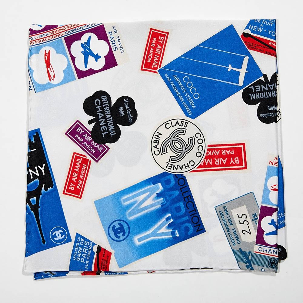 Never worn in the box, Limited edition Chanel Bandanna. From the 2015 Airline's Collection. Made of 100% silk and made in Italy, the square measures 45x45cm. Printed with blue and red colors we can see all the iconic symbols on the drawings ( CC