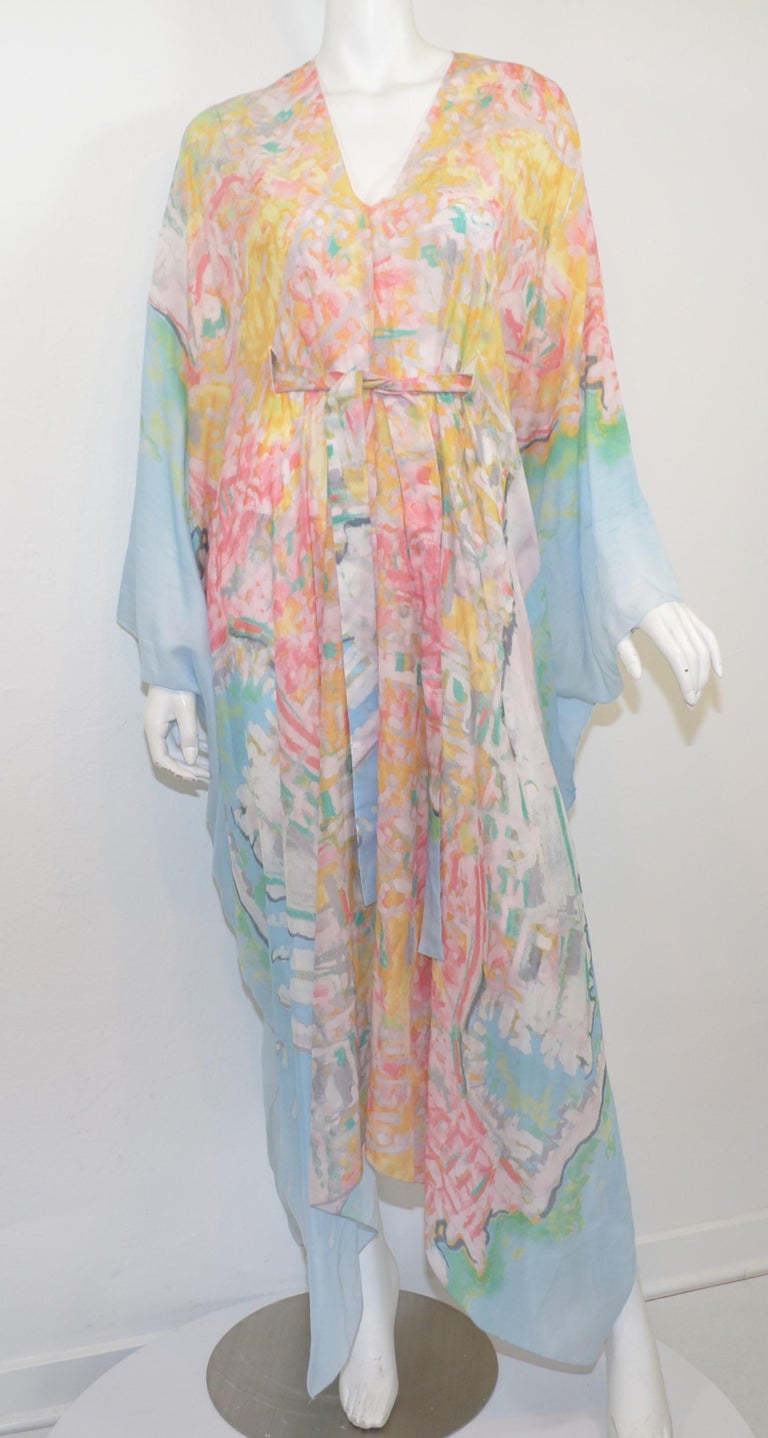 Chanel caftan dress featured in soft watercolors with a self-tie around the waist. From the 2011 C cruise collection. Dress Size is UNI and is composed of 62% silk and 38% cotton. Made in France.

Length 56''